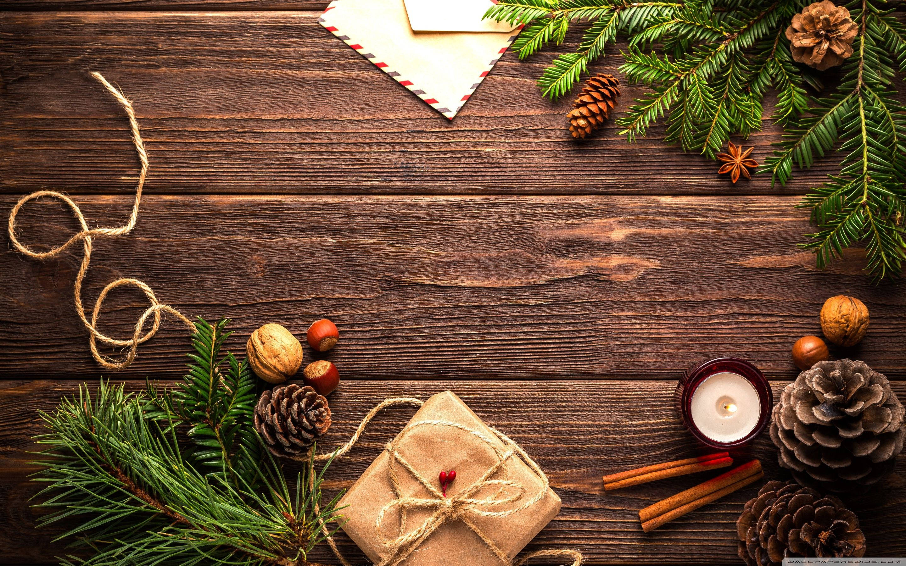 Wooden December Table, pine branches, pinecones, 2K Desktop Wallpaper