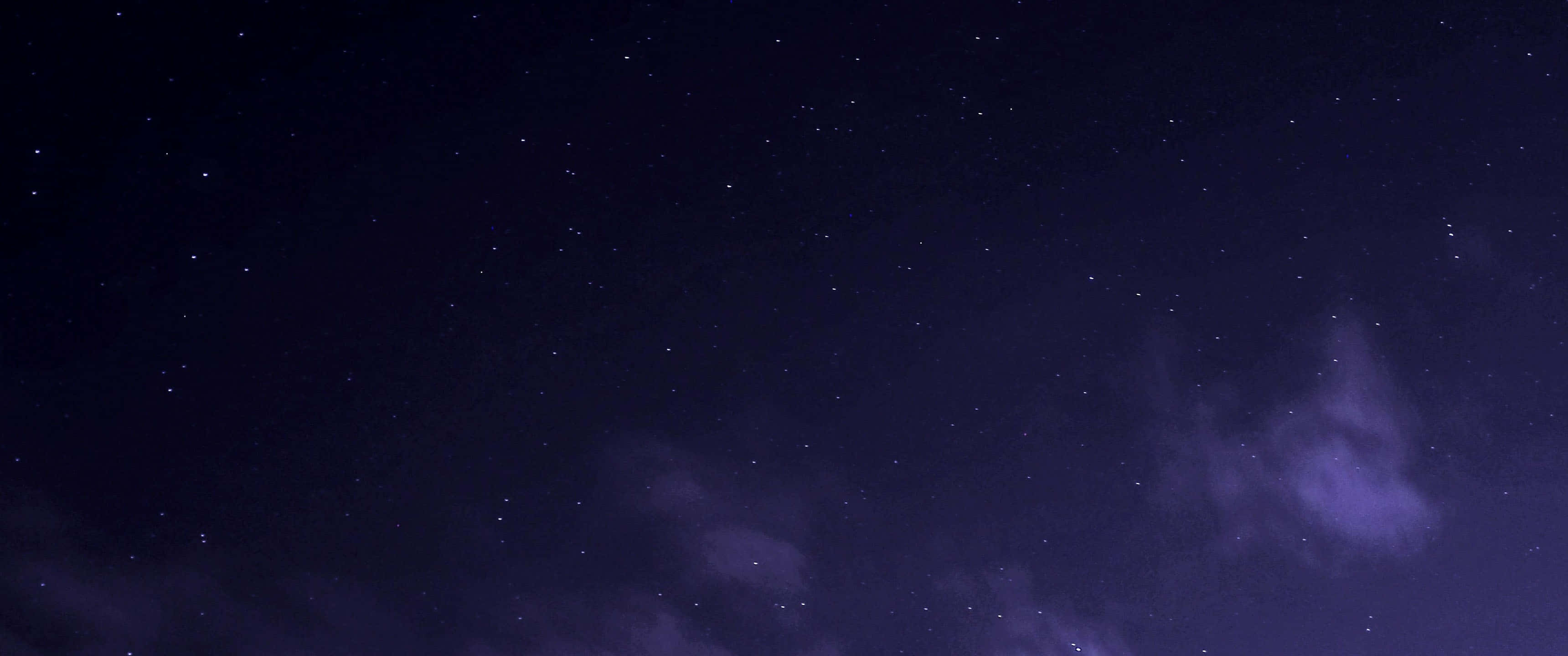 ultra wide 3440x1440, deep purple night sky, twinkling stars, 2K Desktop Wallpaper