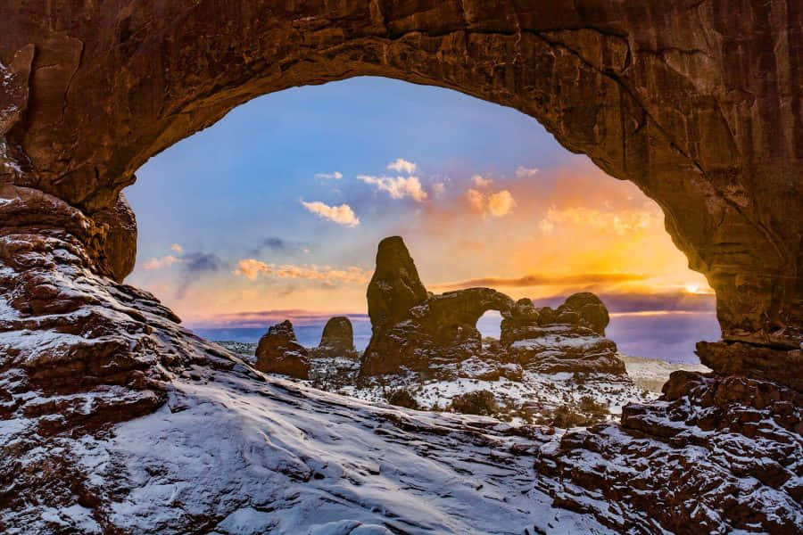 Delicate Arch, snow-dusted, vibrant sunset, SD Desktop Wallpaper