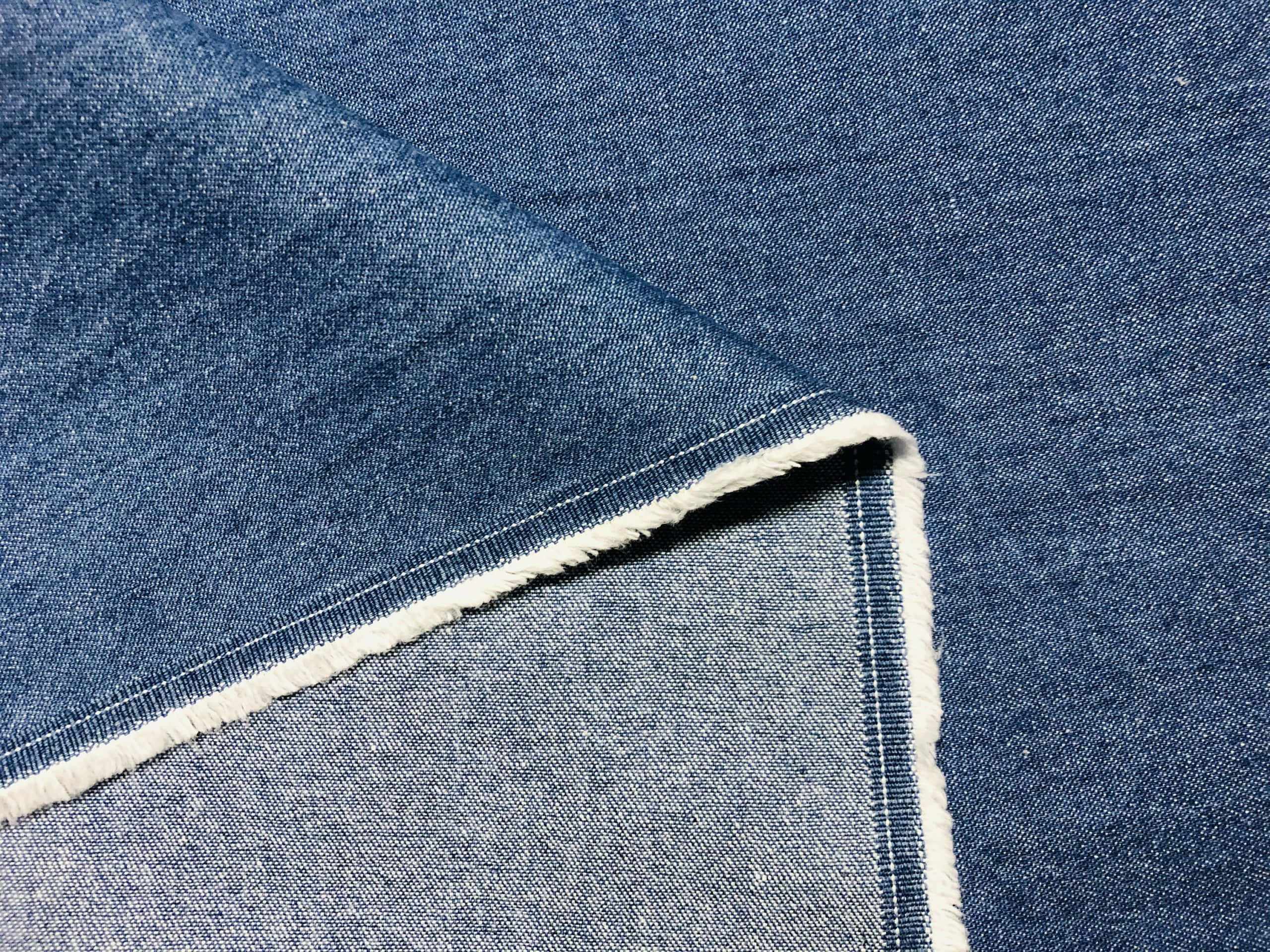 Denim Blue, textured blue denim fabric, frayed white stitching, 2K Desktop Wallpaper