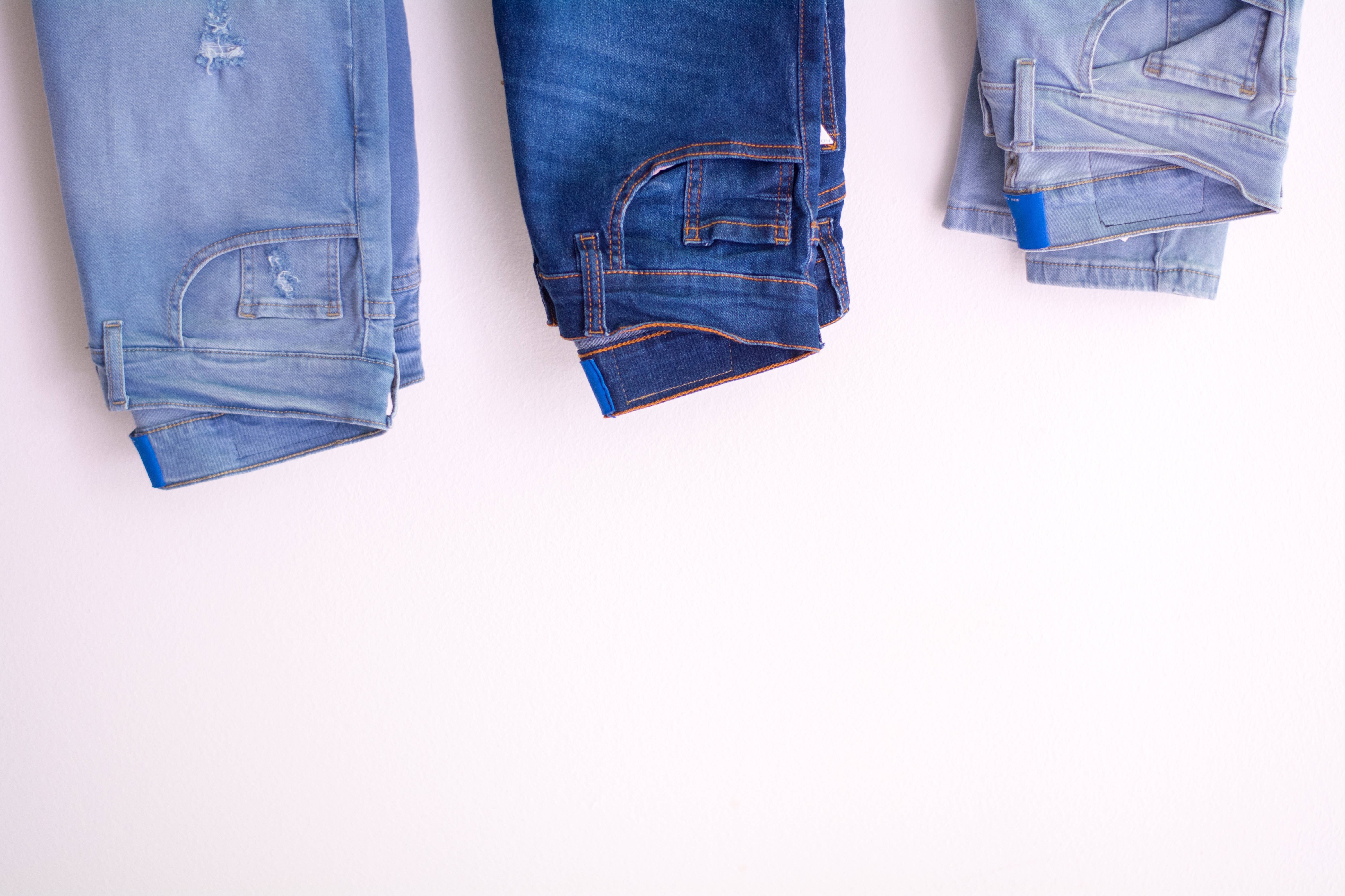 denim jeans, shades of blue, white surface, 5K Desktop Wallpaper