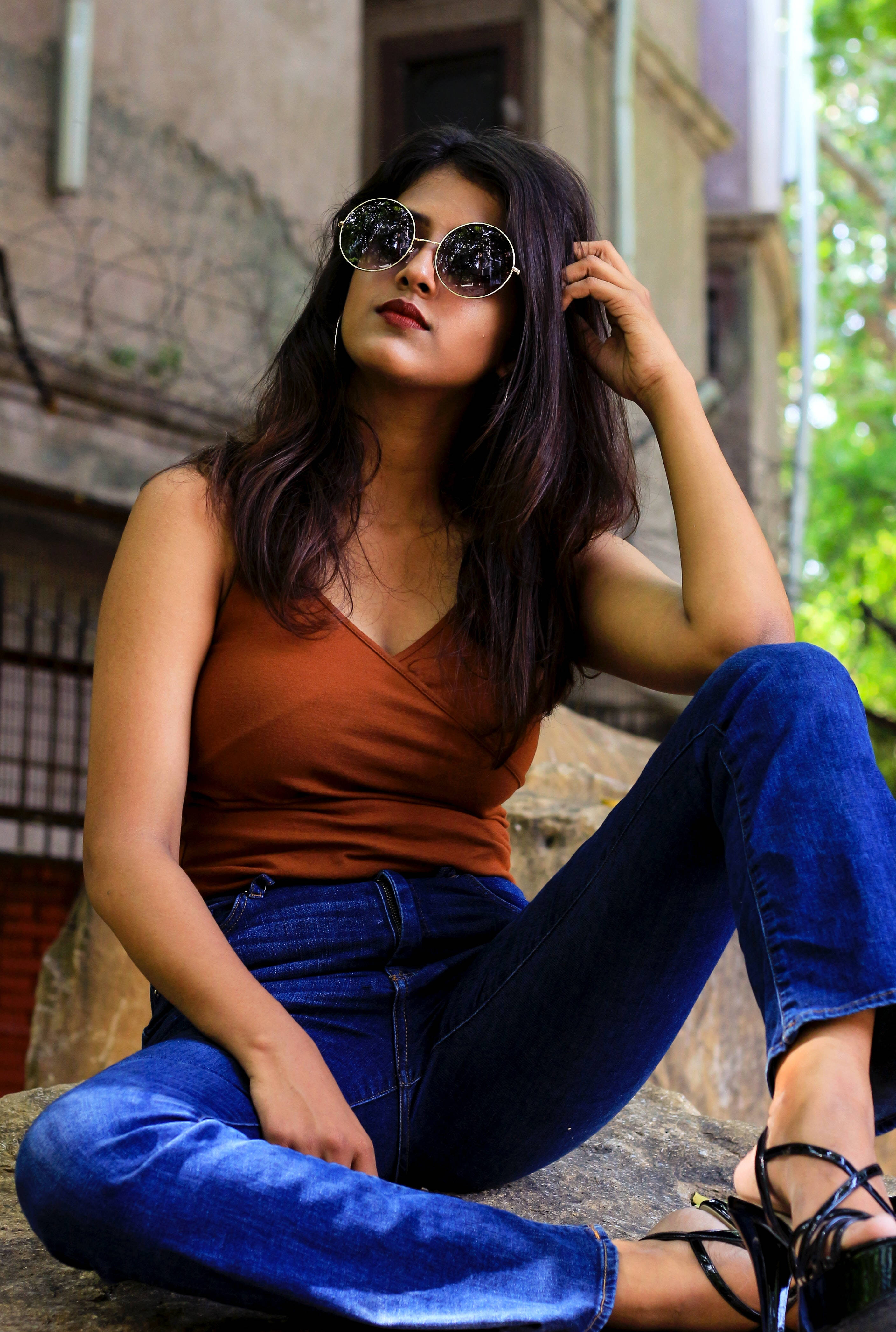 dark blue jeans, round sunglasses, stone ledge, 4K Phone Wallpaper