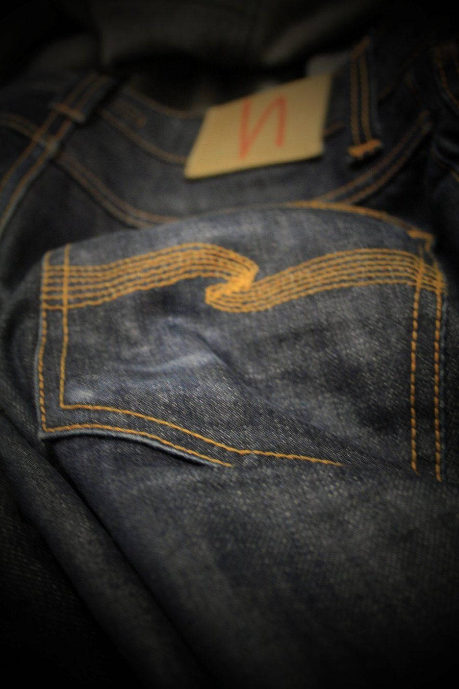 dark denim jeans, orange stitching, beige brand tag, HD Phone Wallpaper