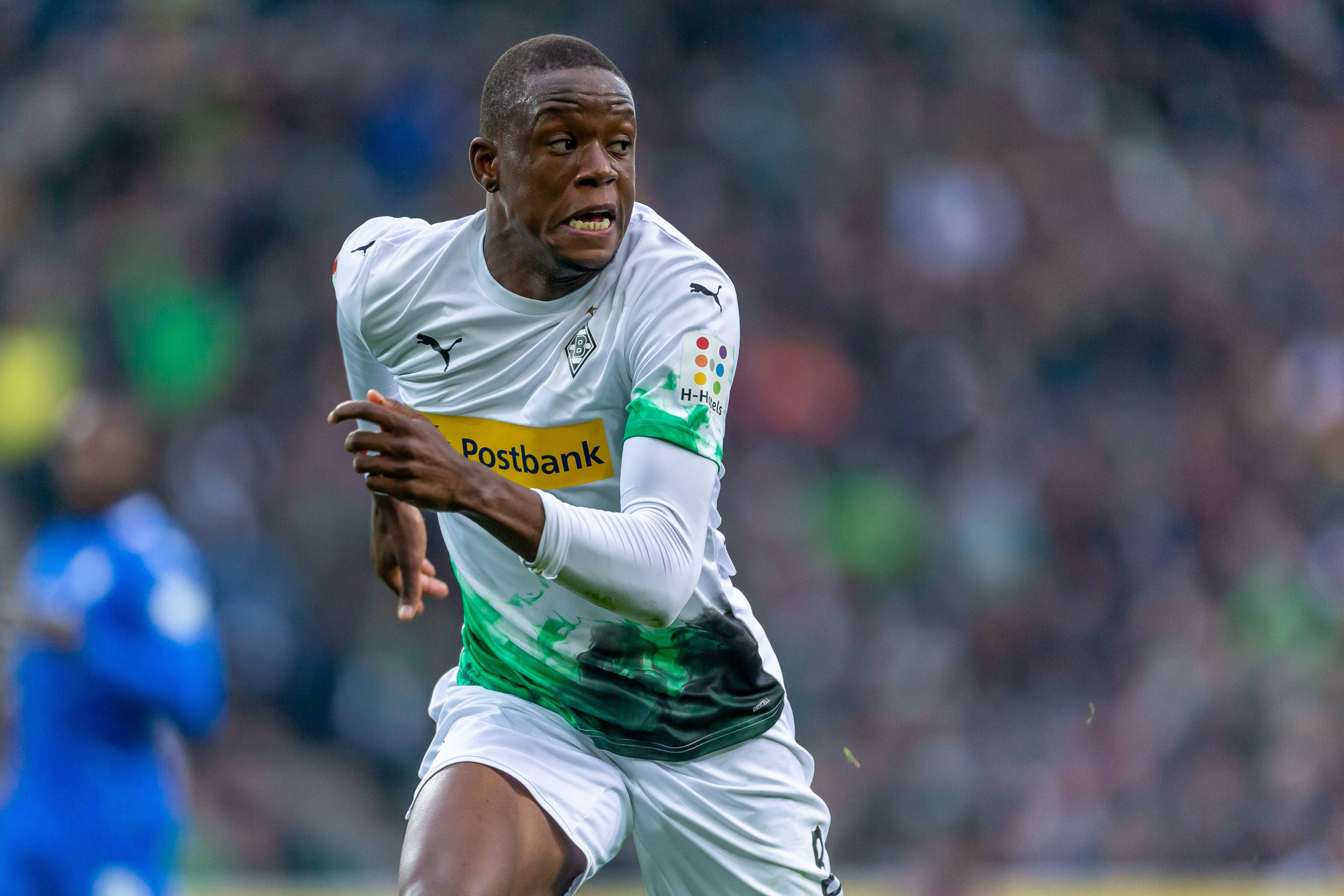 Denis Zakaria, white and green kit, sunlit field, 2K Desktop Wallpaper