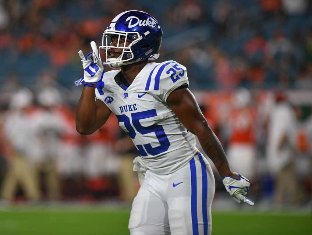 Duke football player, white and blue uniform, number 25, SD Desktop Wallpaper