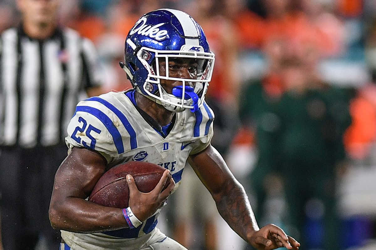 Duke University football player, blue and white gear, night game, SD Desktop Wallpaper