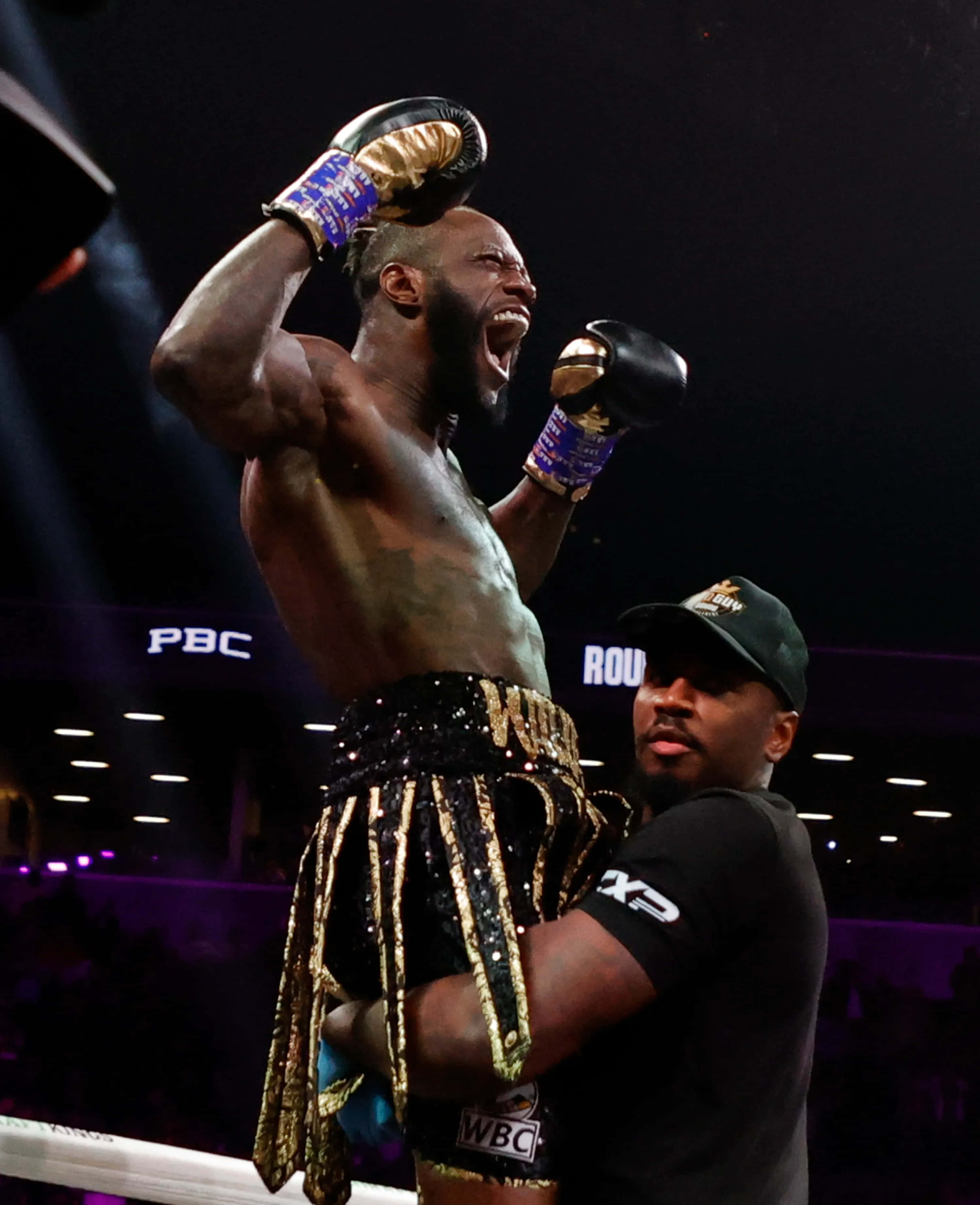 Deontay Wilder, gold and black trunks, black shirt, 2K Phone Wallpaper