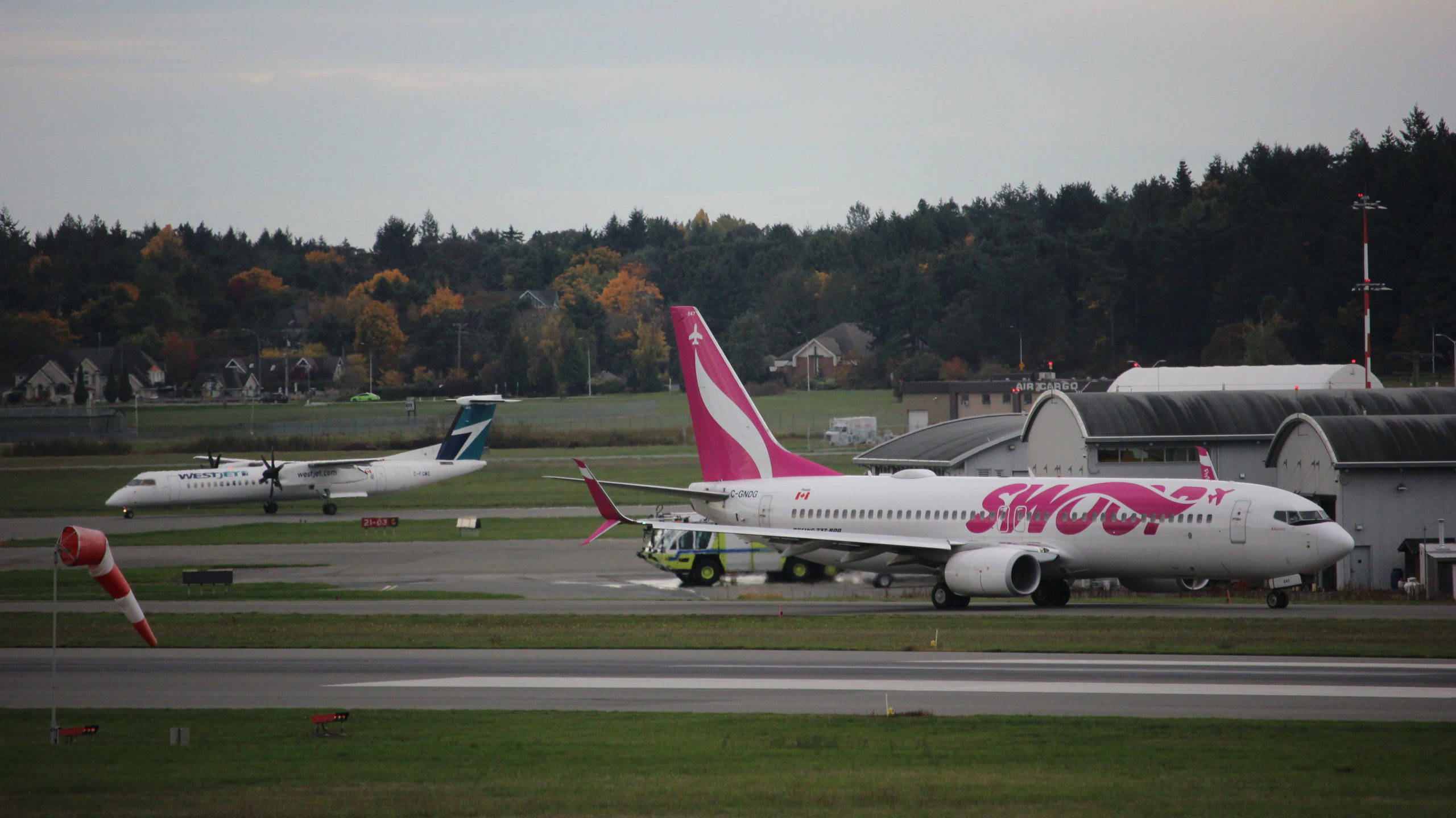 Swoop airplane, pink and white, runway, 2K Desktop Wallpaper