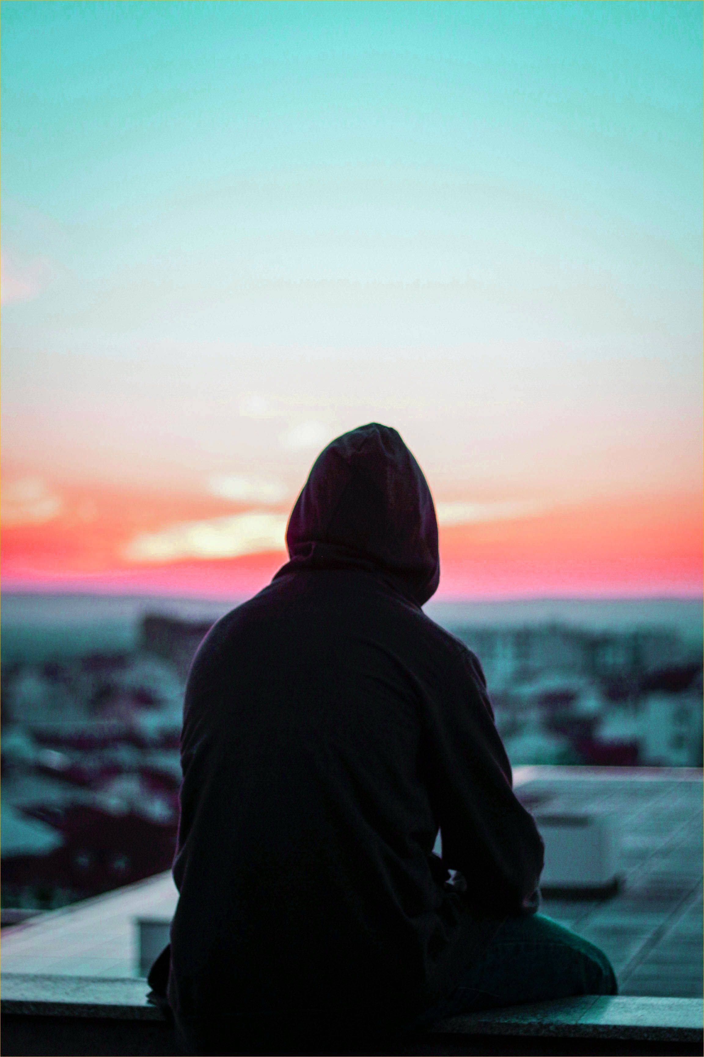 hooded figure, rooftop, sunset, 2K Phone Wallpaper
