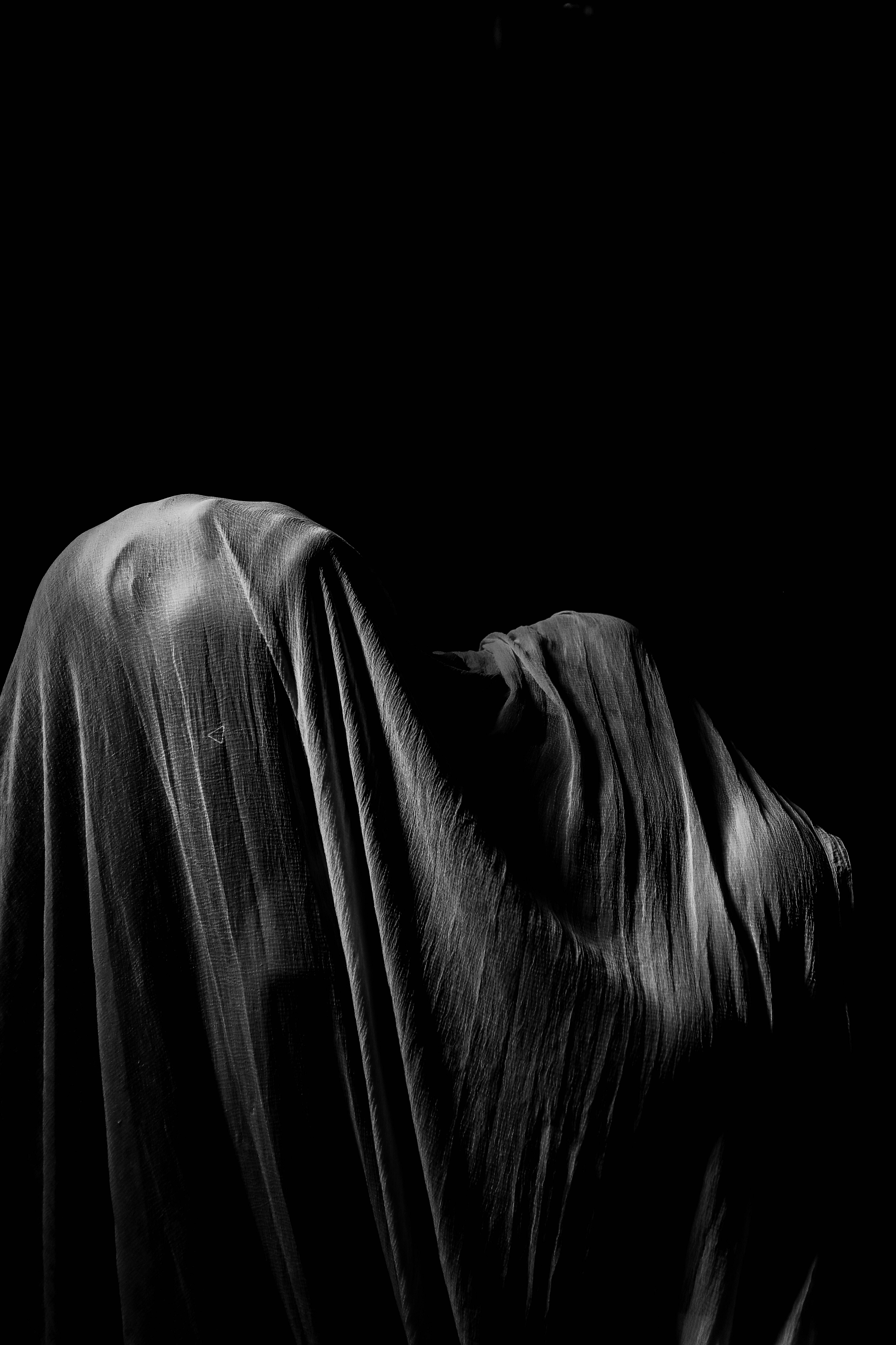 depression aesthetic, hooded silhouette, stark black background, 5K Phone Wallpaper