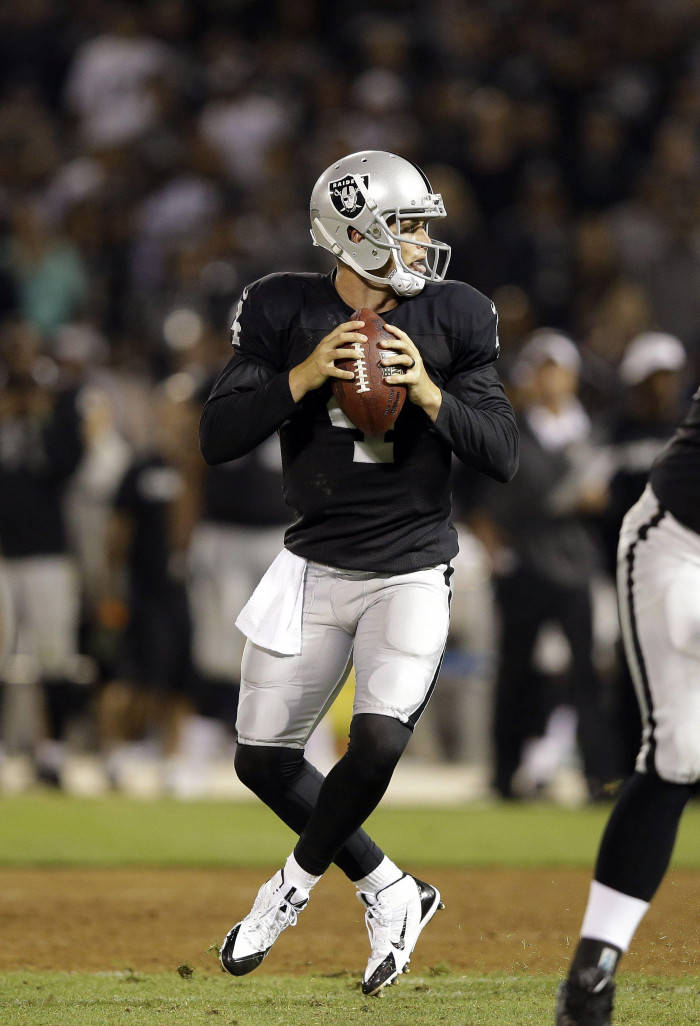 Derek Carr, black and silver uniform, stadium lights, SD Phone Wallpaper