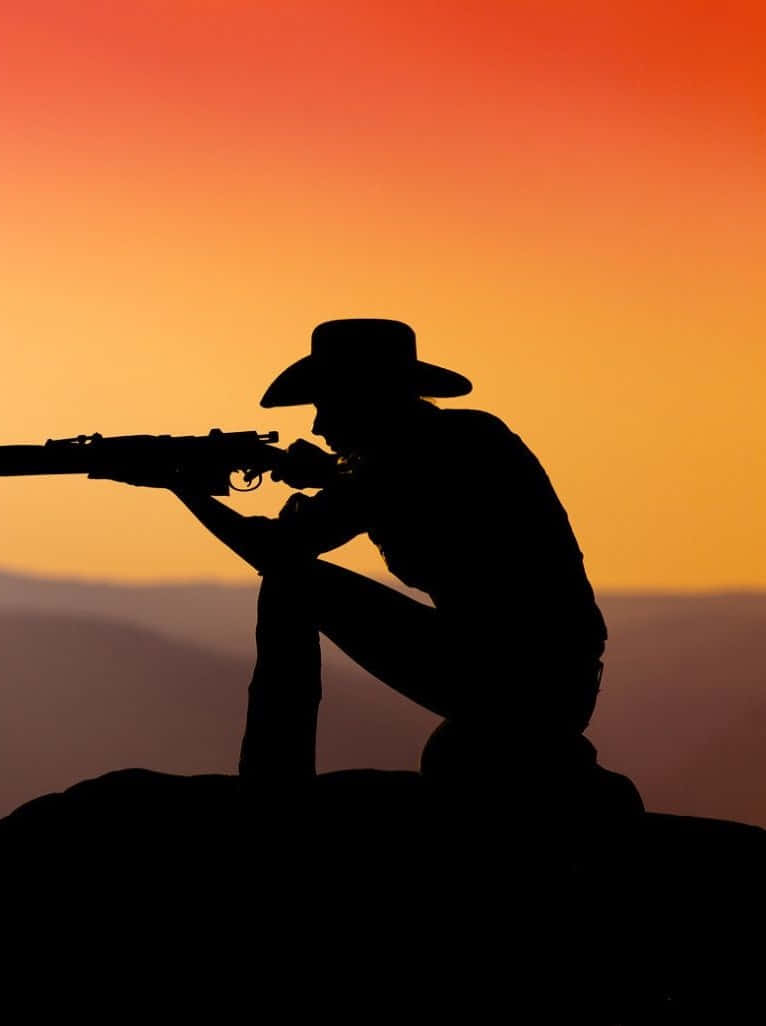 cowboy, rifle, rocky outcrop, SD Phone Wallpaper