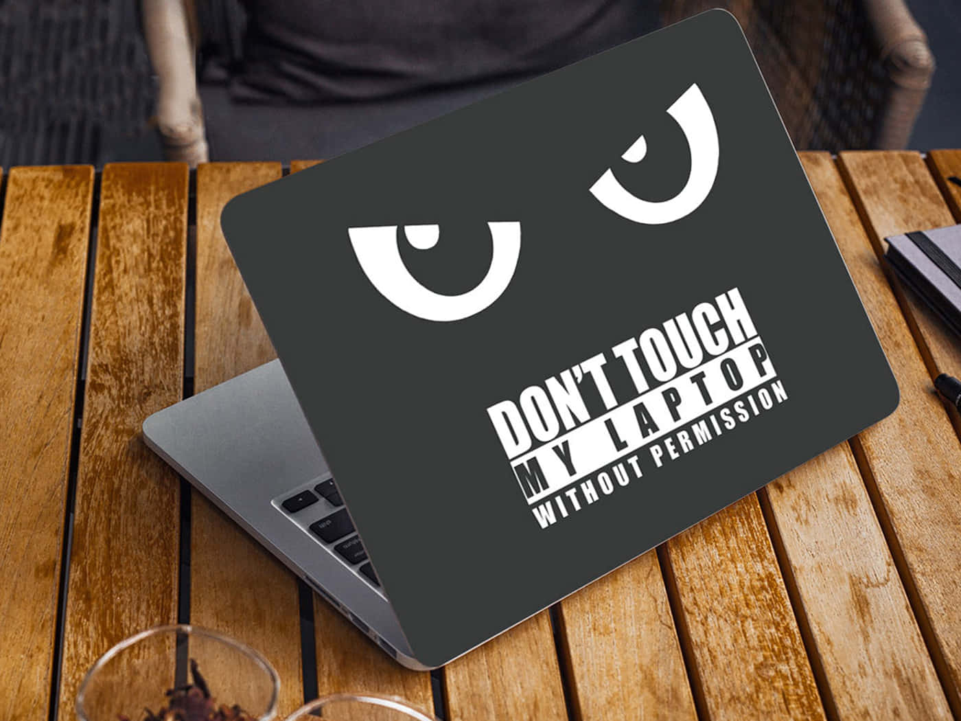 laptop, wooden table, mischievous cartoon face sticker, HD Desktop Wallpaper