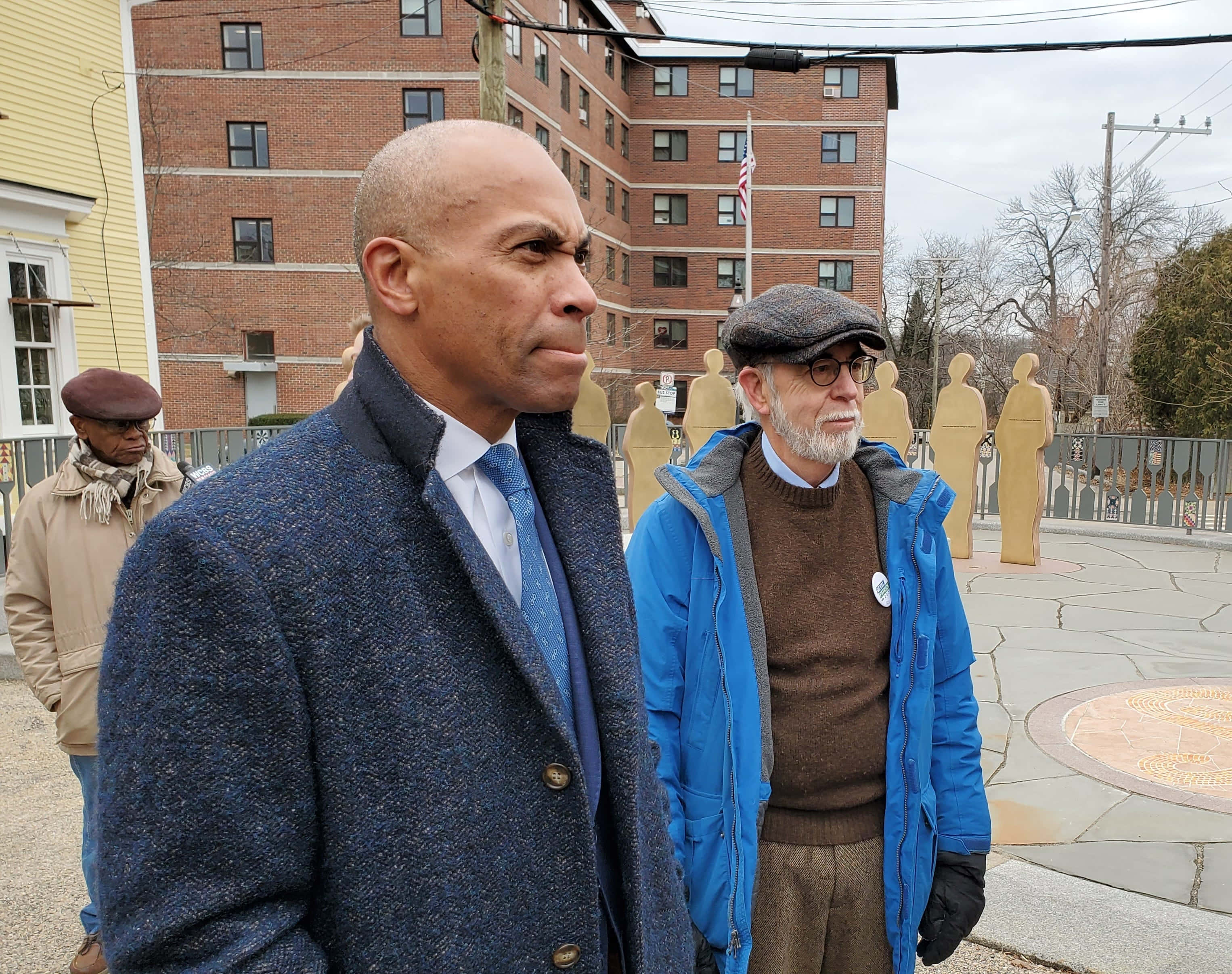 Deval Patrick, golden statues, brick buildings, 2K Desktop Wallpaper