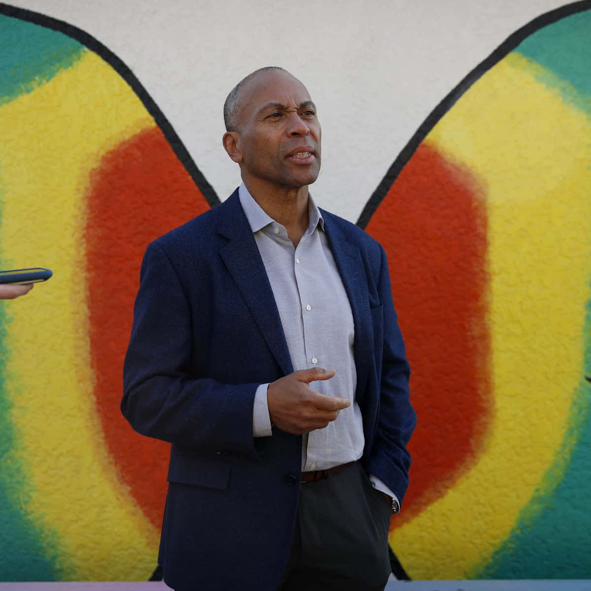Deval Patrick, navy blazer, vibrant abstract mural, SD Desktop Wallpaper