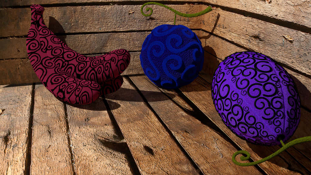 Devil Fruit, three stylized fruit plushies, swirling patterns, SD Desktop Wallpaper