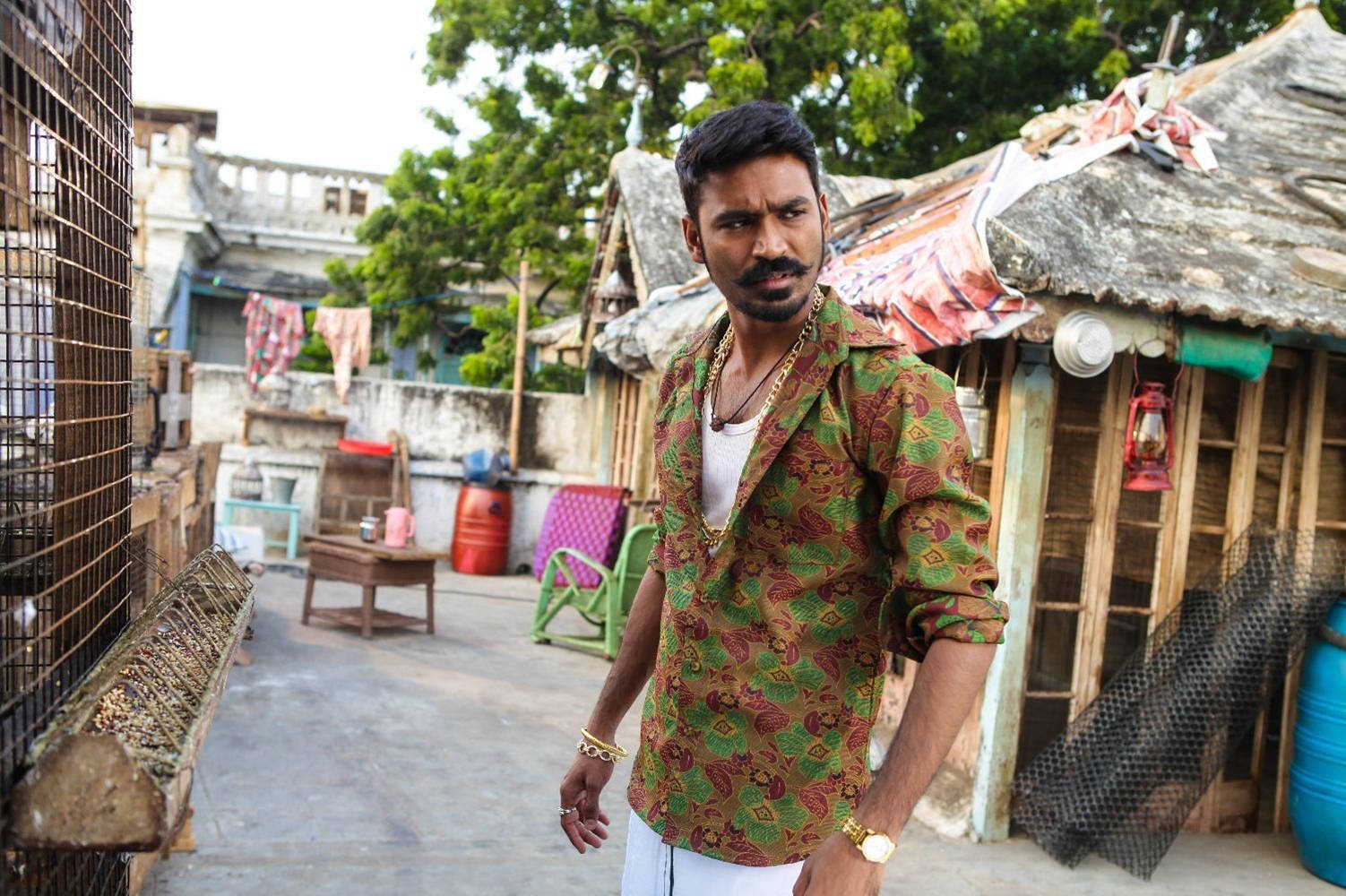 Dhanush, patterned green and brown shirt, cluttered urban alleyway, HD Desktop Wallpaper
