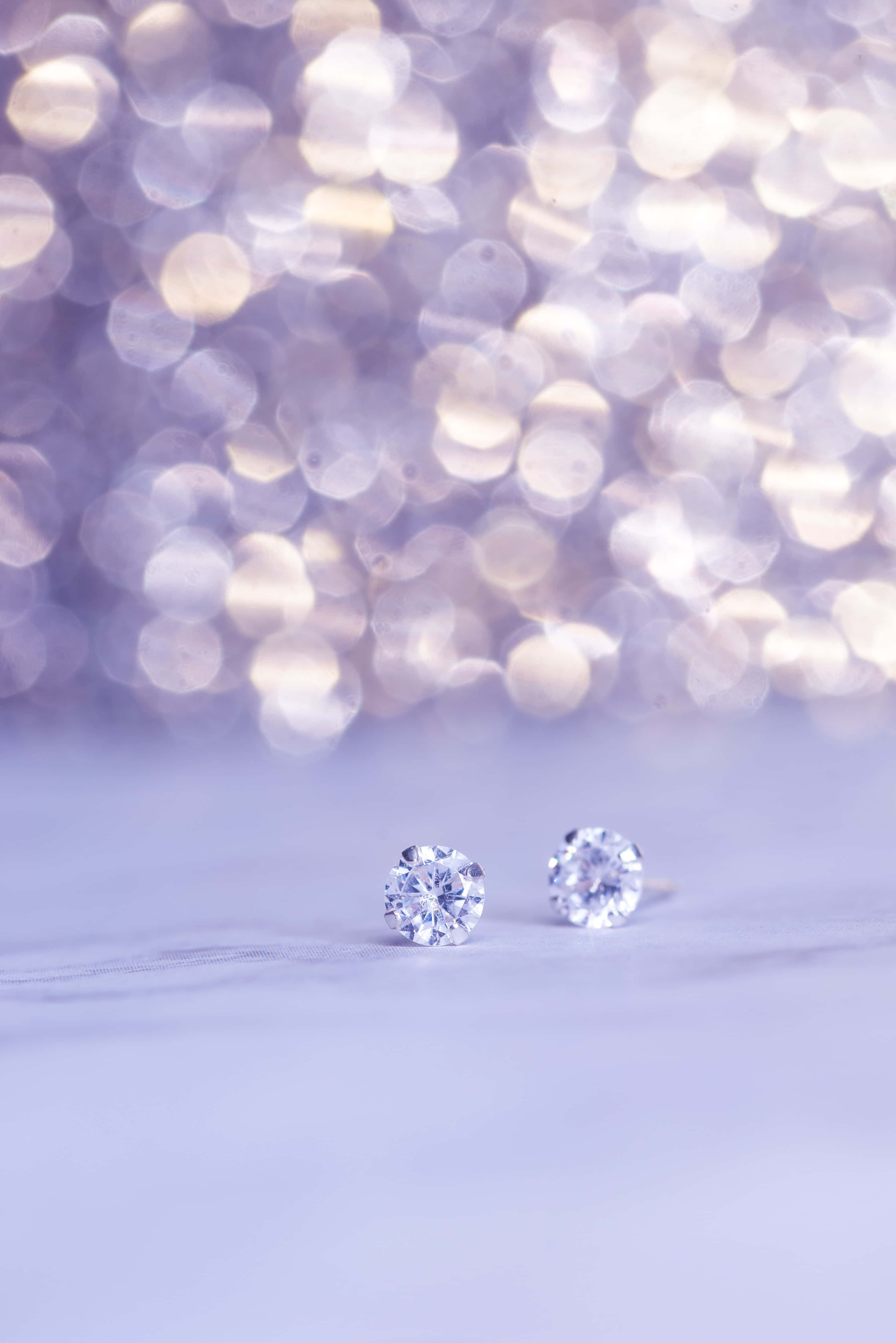 diamond stud earrings, lavender surface, bokeh background, 4K Phone Wallpaper