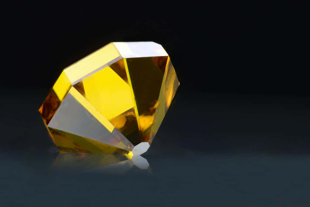 yellow diamond, faceted, dark reflective surface, SD Desktop Wallpaper