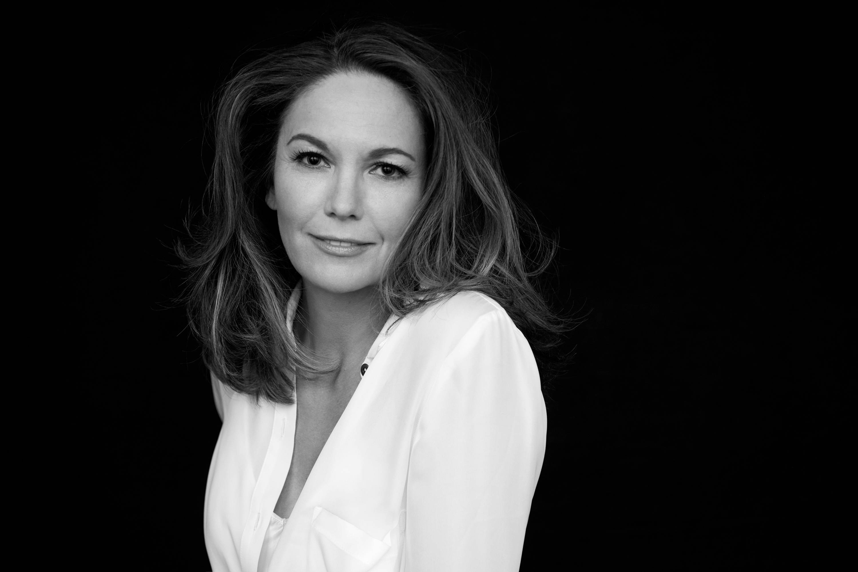 Diane Lane, shoulder-length hair, stark black background, 2K Desktop Wallpaper