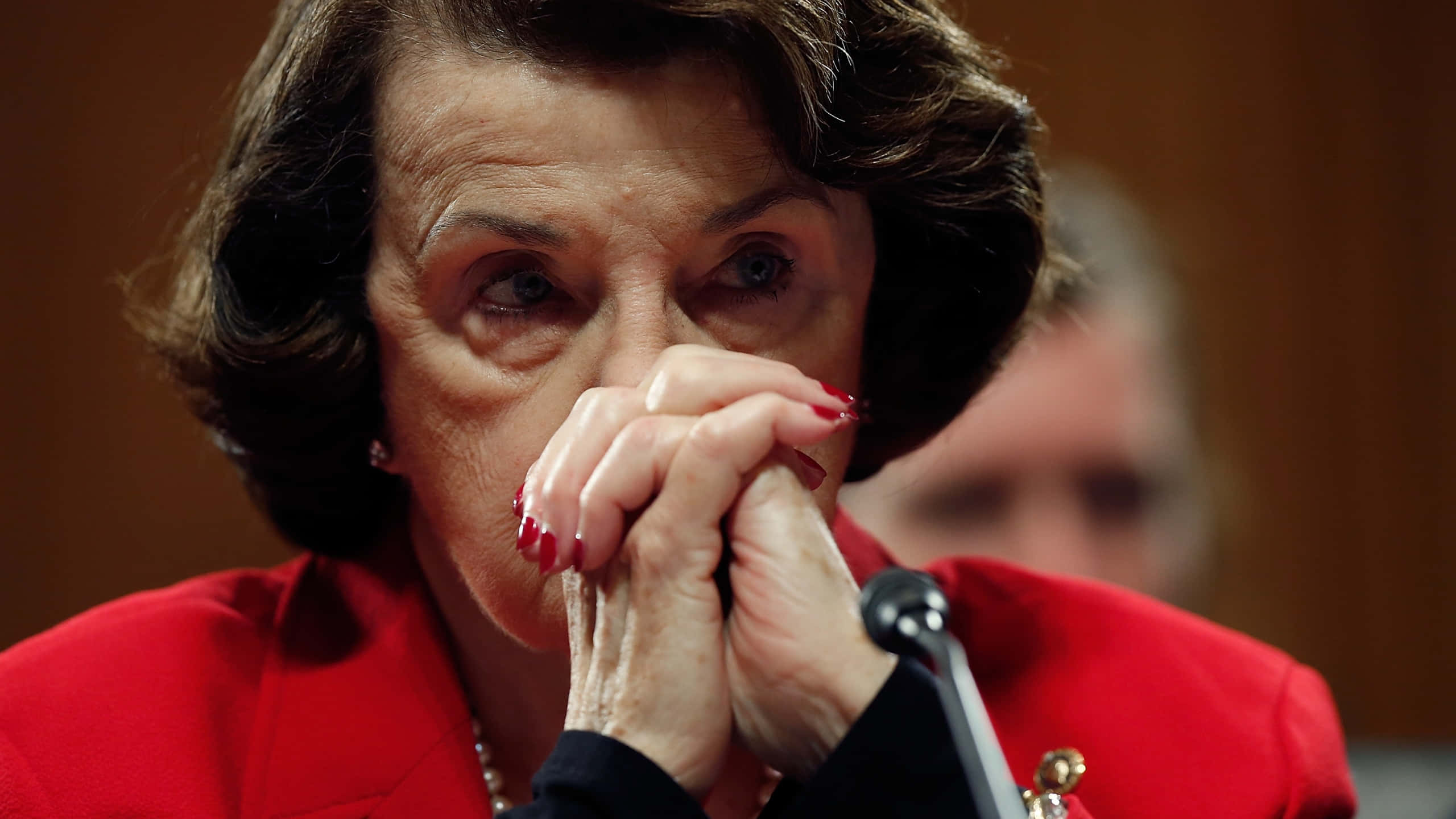 Dianne Feinstein, red blazer, hands clasped, 2K Desktop Wallpaper