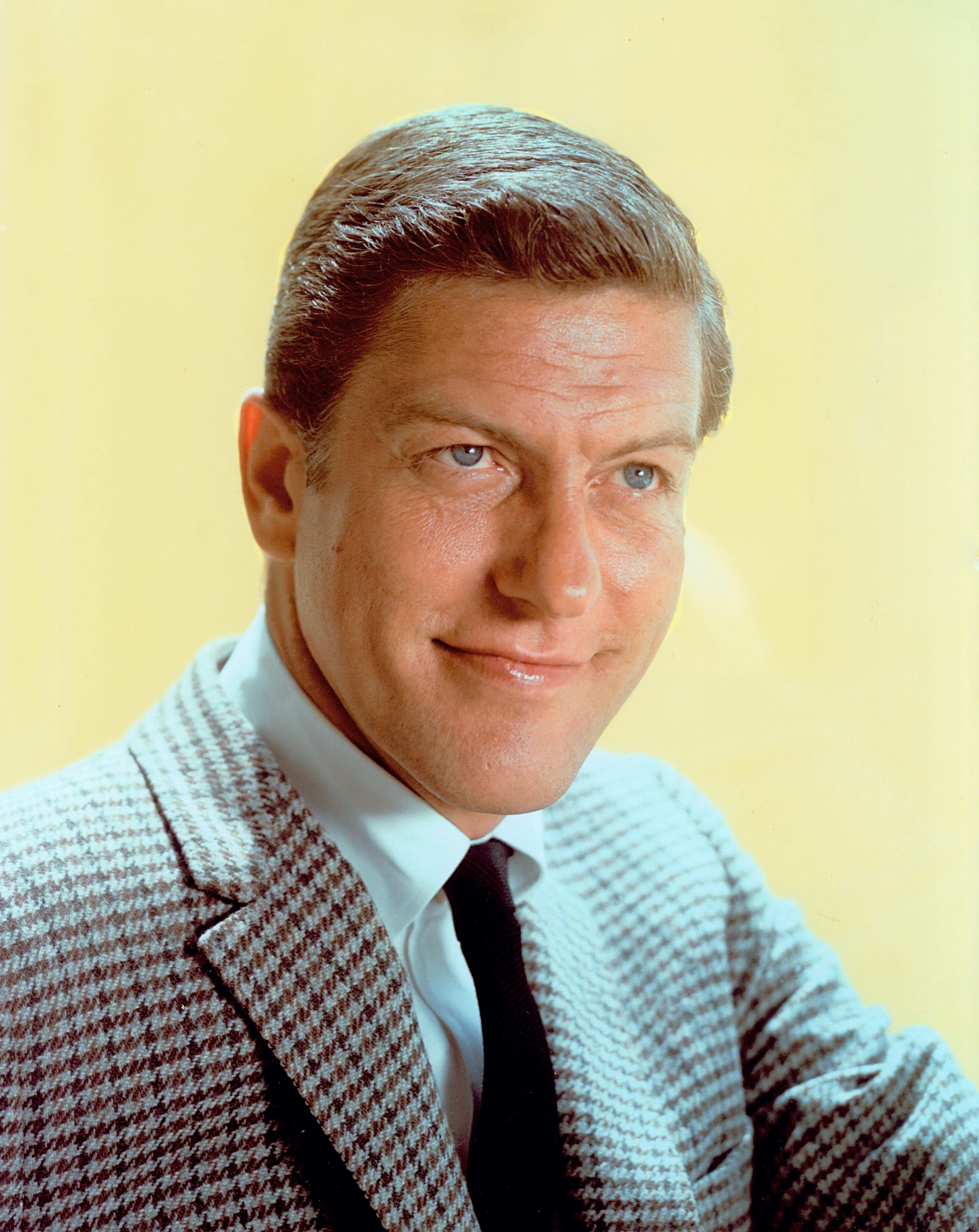 Dick Van Dyke, houndstooth suit, pale yellow background, 5K Phone Wallpaper