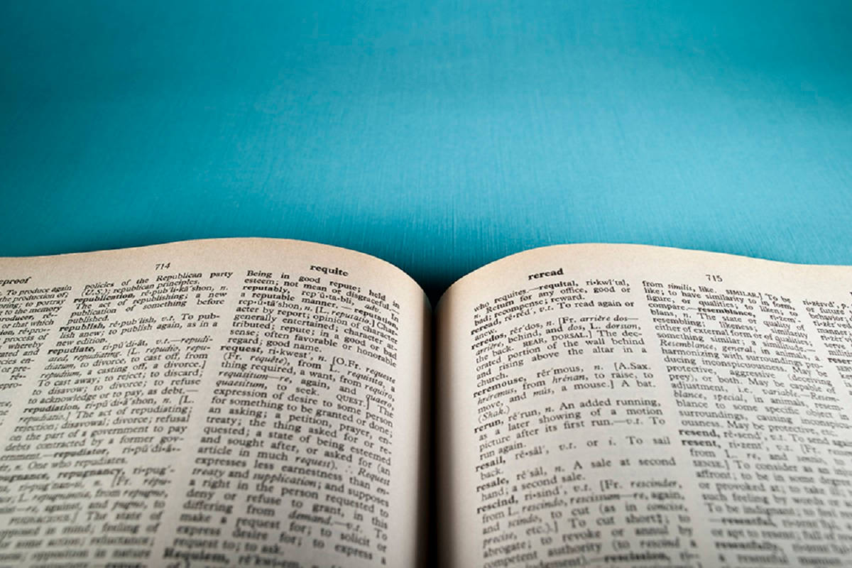 open dictionary book, vibrant blue textured surface, crisp white pages, SD Desktop Wallpaper