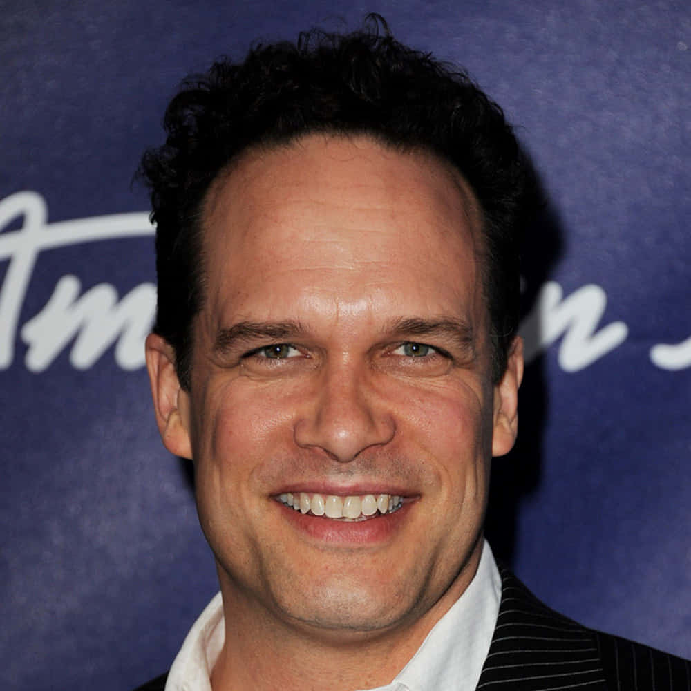 Diedrich Bader, pinstripe suit, blue backdrop, SD Desktop Wallpaper