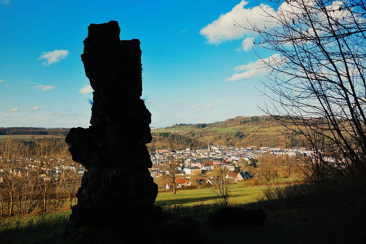 Diekirch, stone monolith, bright blue sky, SD Desktop Wallpaper