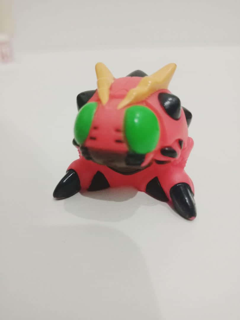 Digimon Tentomon, red plastic toy monster, green eyes, SD Phone Wallpaper