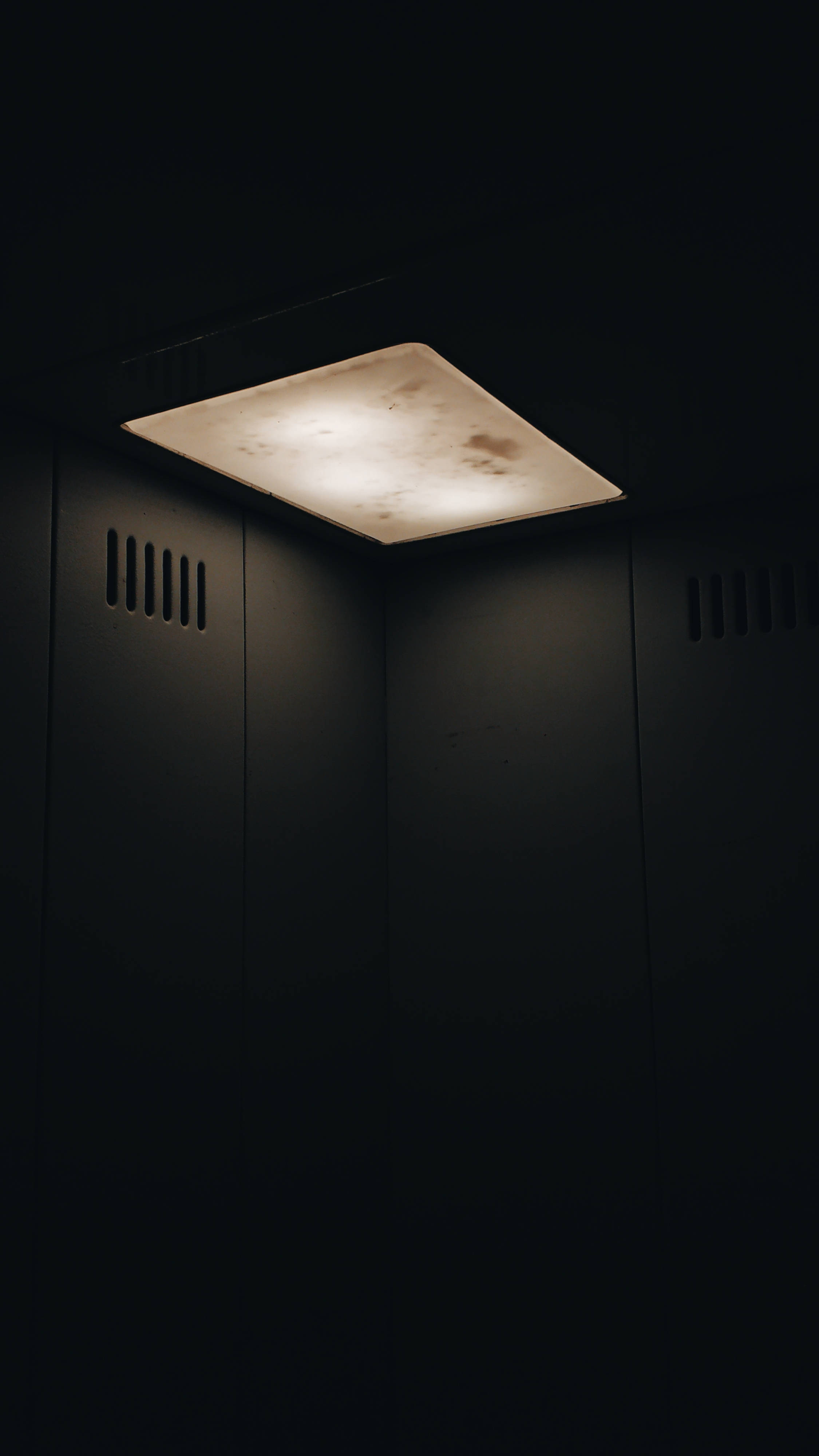 dim light, elevator, warm glow, 4K Phone Wallpaper