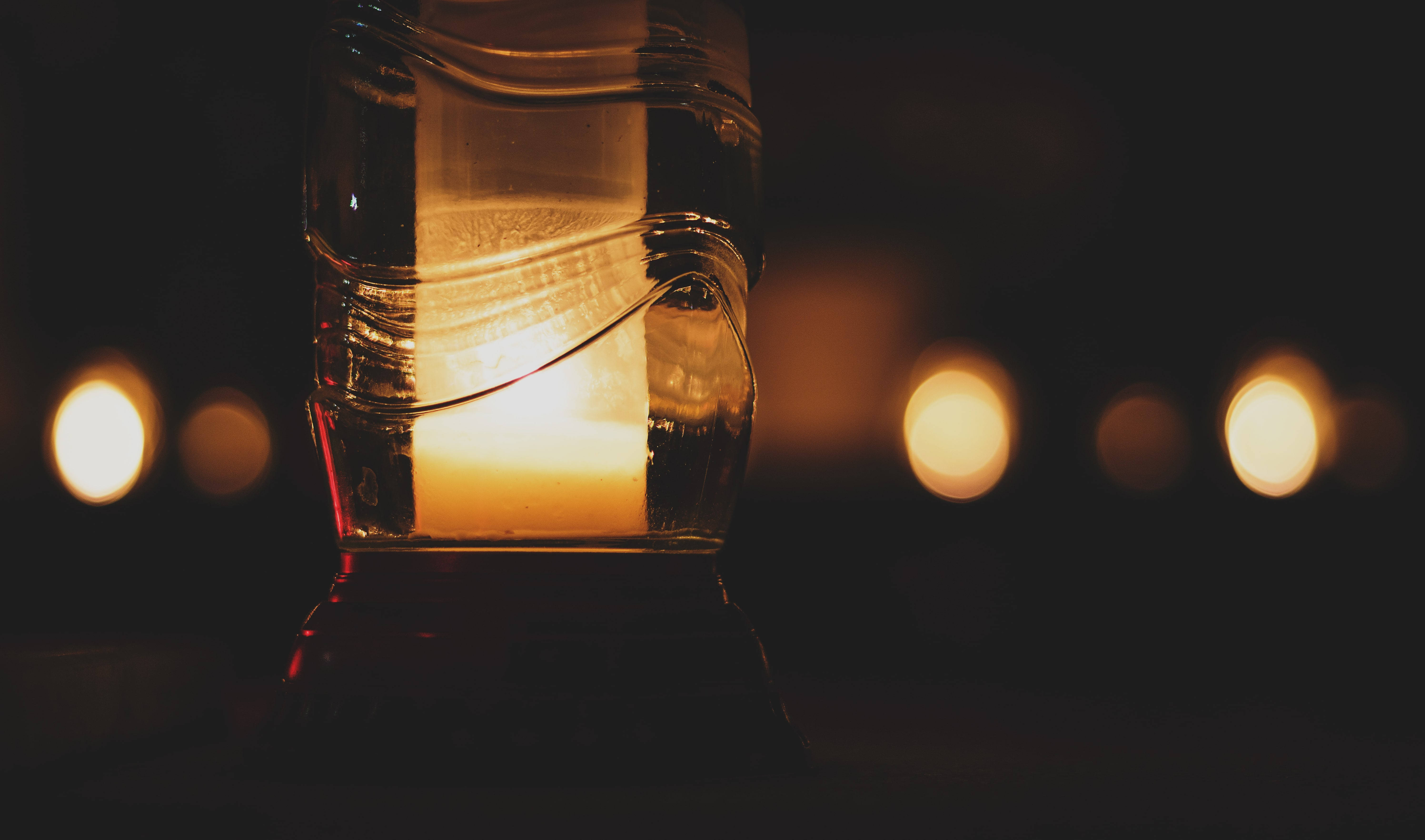 lit candle, textured glass lantern, warm light, 5K Desktop Wallpaper