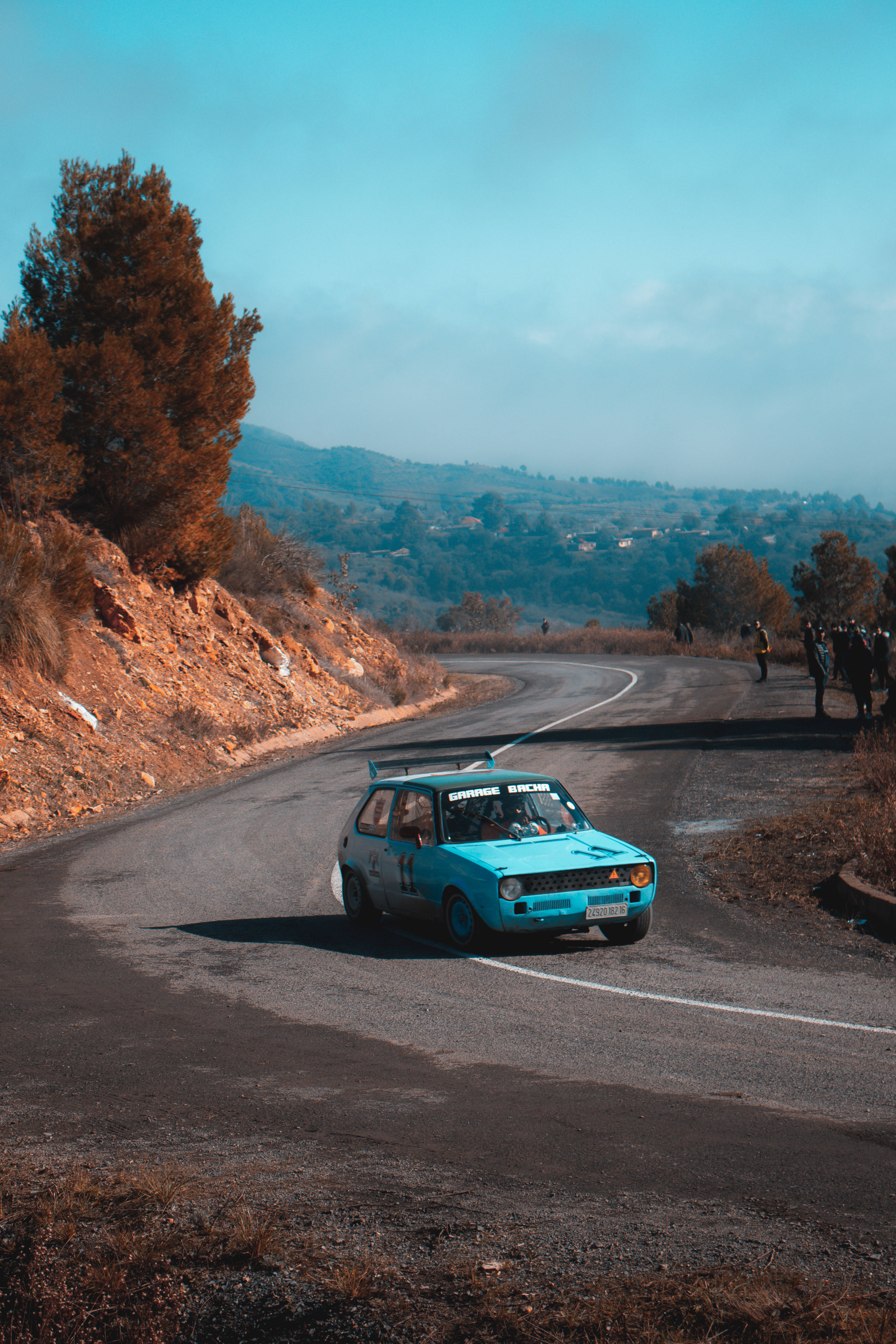 Dirt Rally, light blue car, winding mountain road, 5K Phone Wallpaper