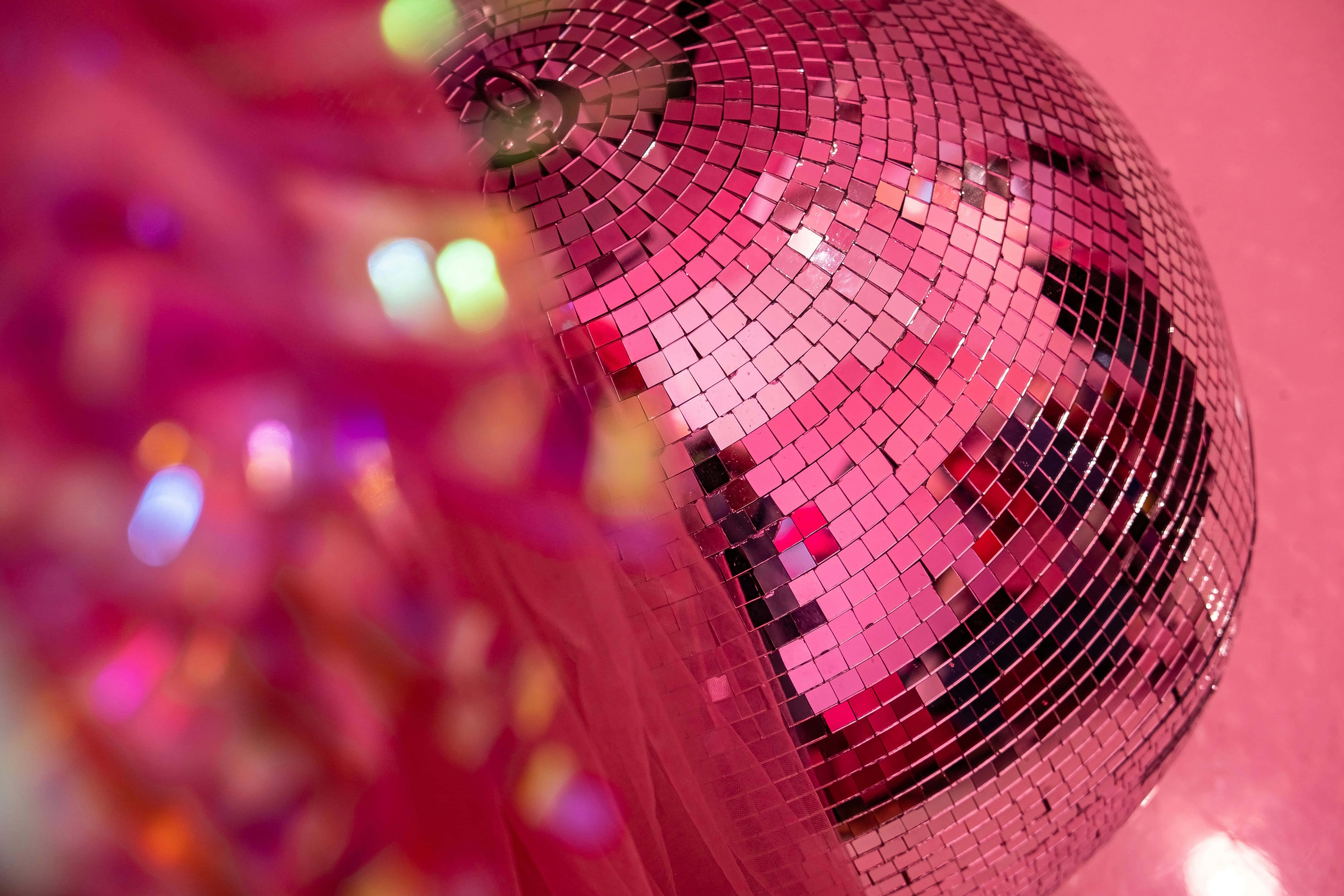 pink disco ball, vibrant lights, soft pink background, 5K Desktop Wallpaper