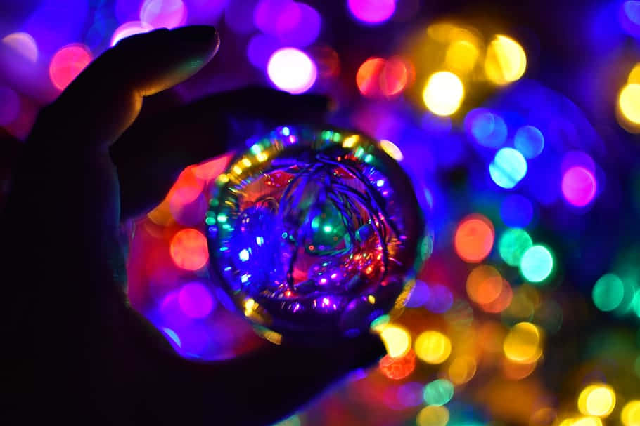 handheld disco ball illusion, glass orb, vibrant bokeh lights, SD Desktop Wallpaper