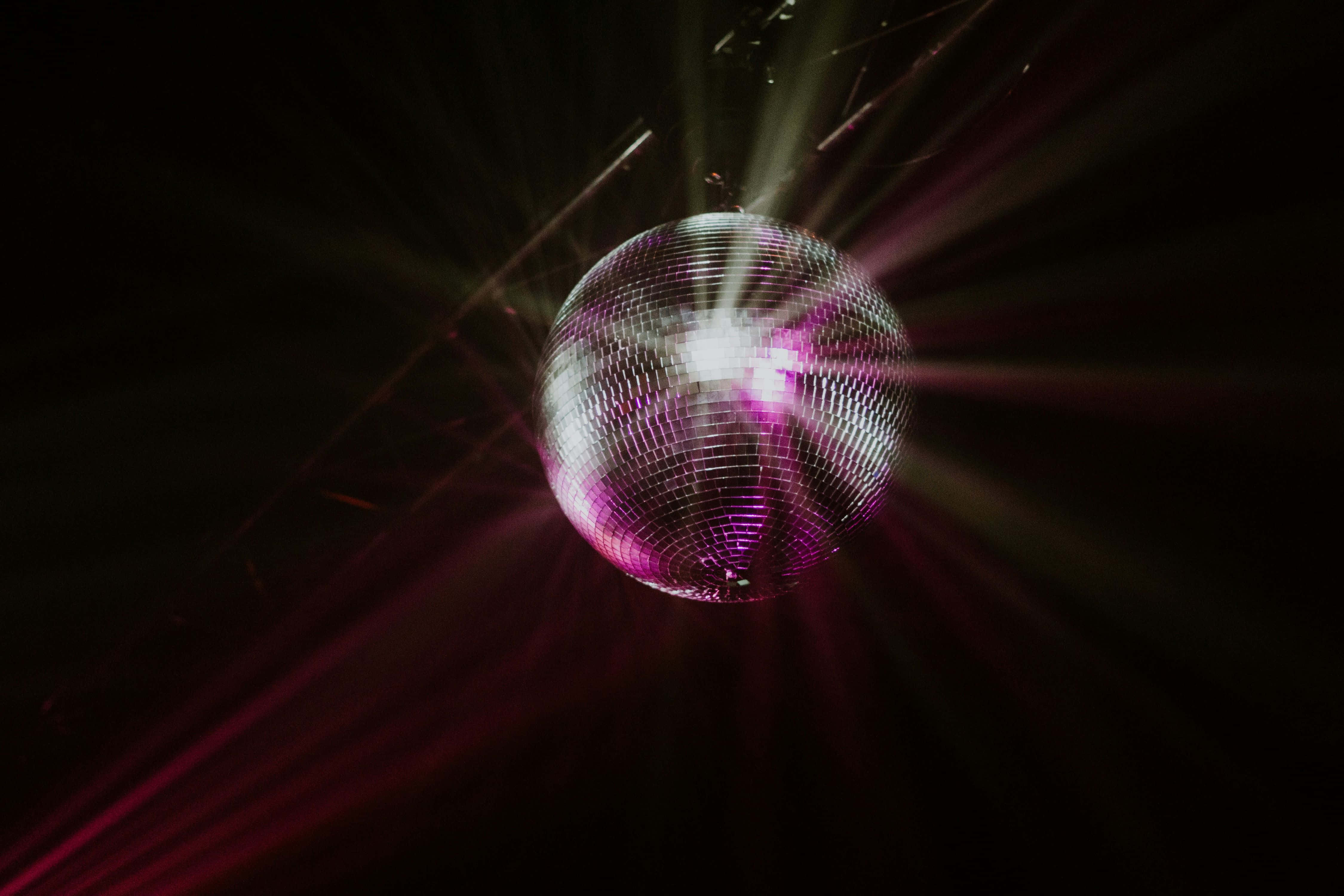 disco ball, vibrant purple, white light beams, 4K Desktop Wallpaper