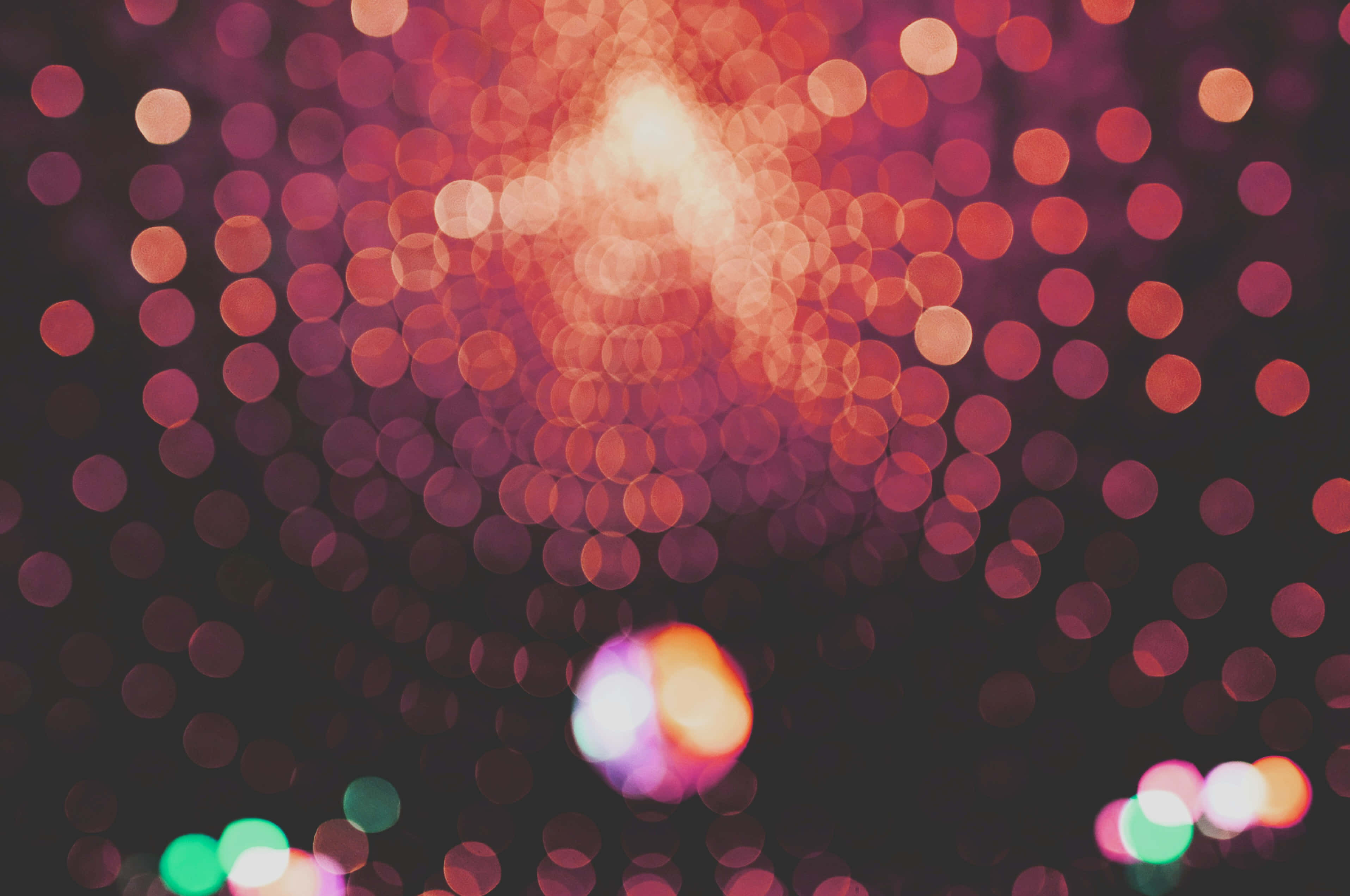 abstract disco lights, bokeh effect, glowing red orange and green lights, 2K Desktop Wallpaper
