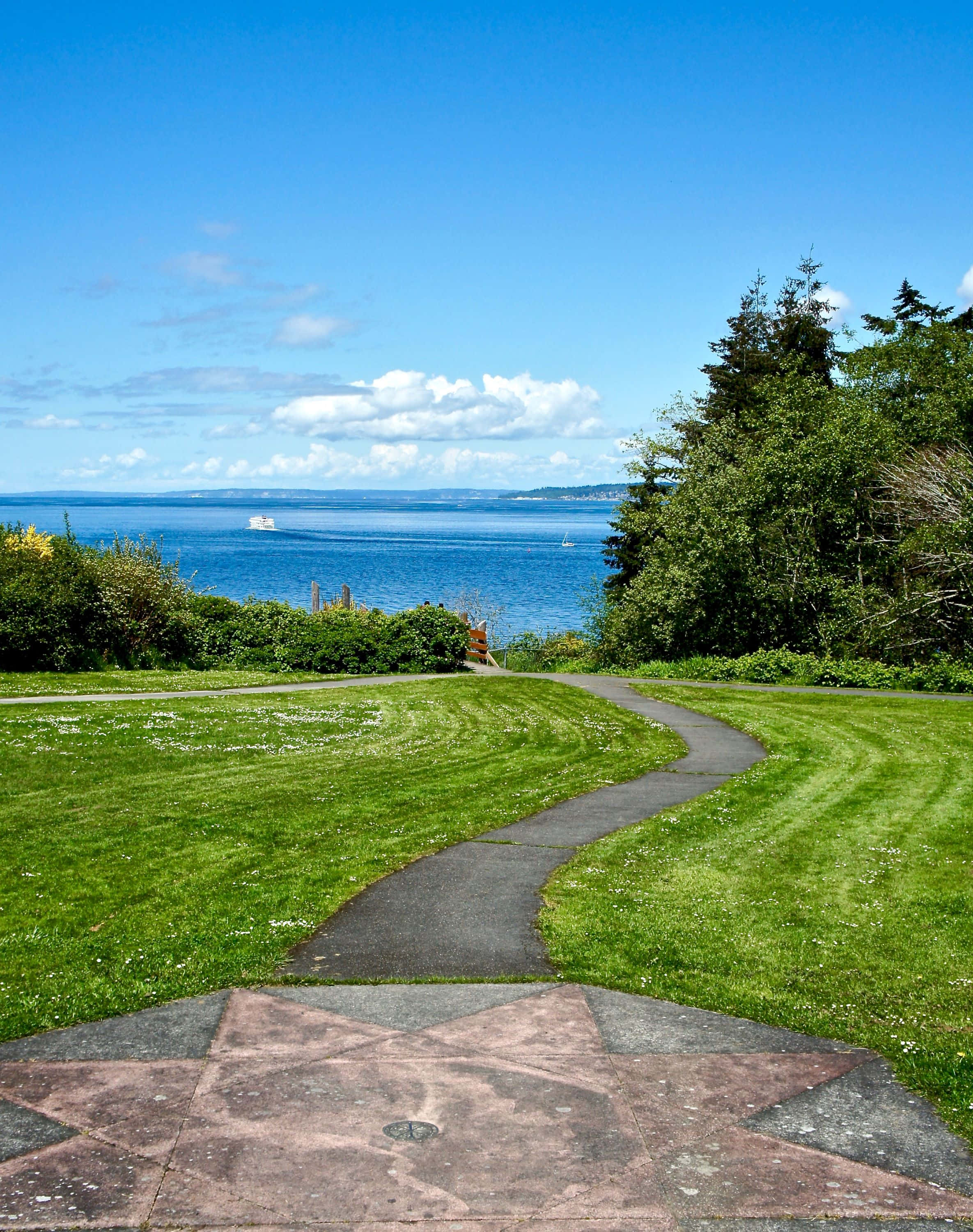 Discovery Park Seattle, paved path, vibrant green grass, 2K Phone Wallpaper