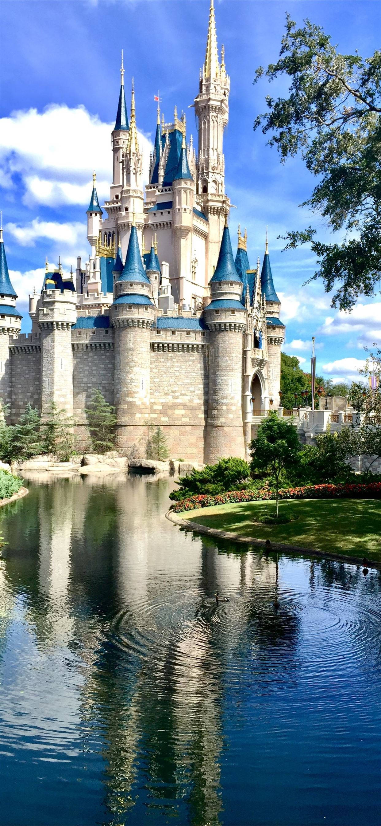 Disney Castle, blue spires, stone towers, 2K Phone Wallpaper