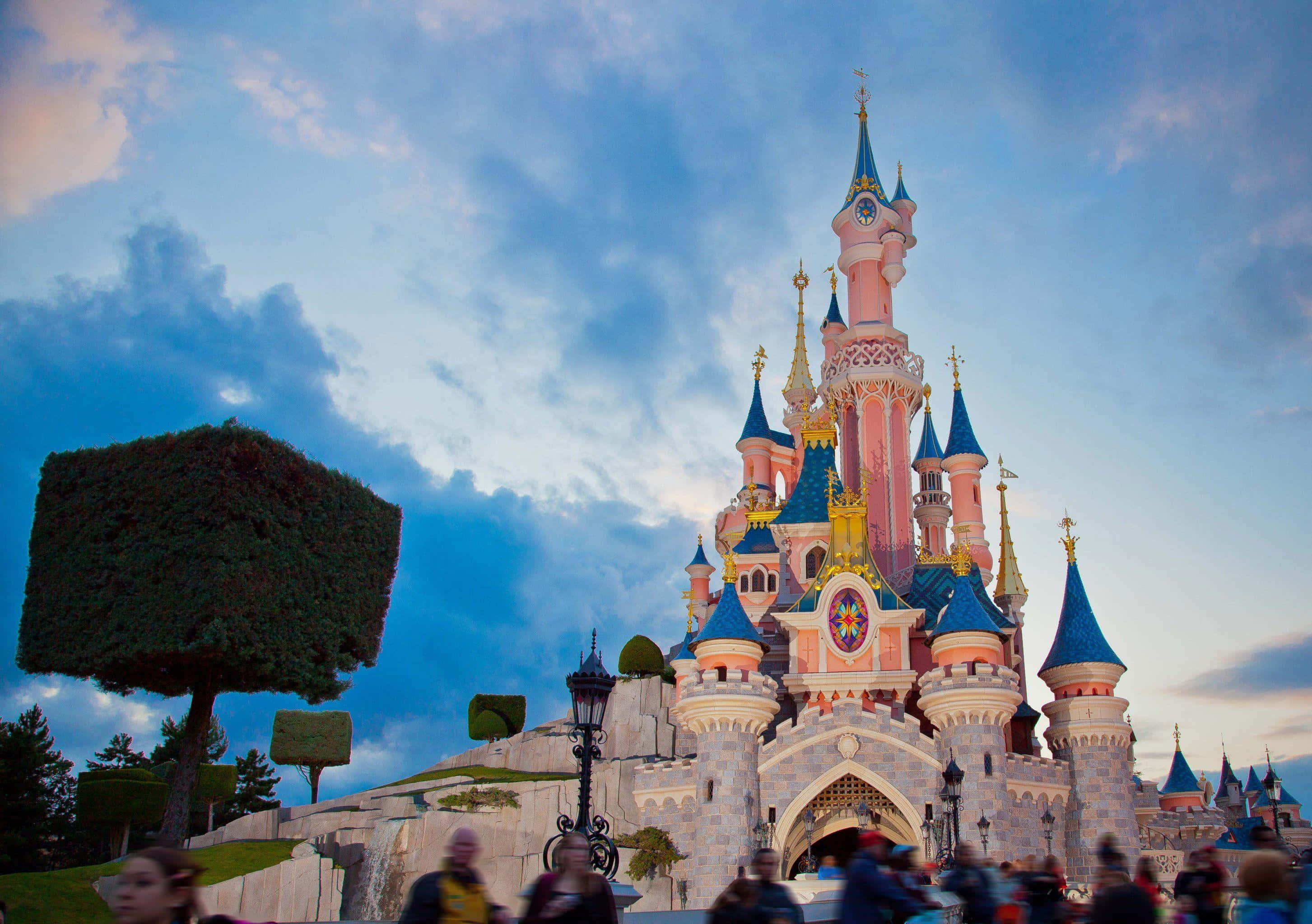 Disneyland Paris, pink and blue castle, golden spires, 2K Desktop Wallpaper