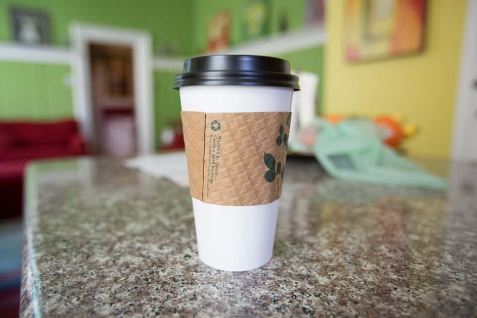 white to-go coffee cup, brown sleeve, speckled granite countertop, SD Desktop Wallpaper