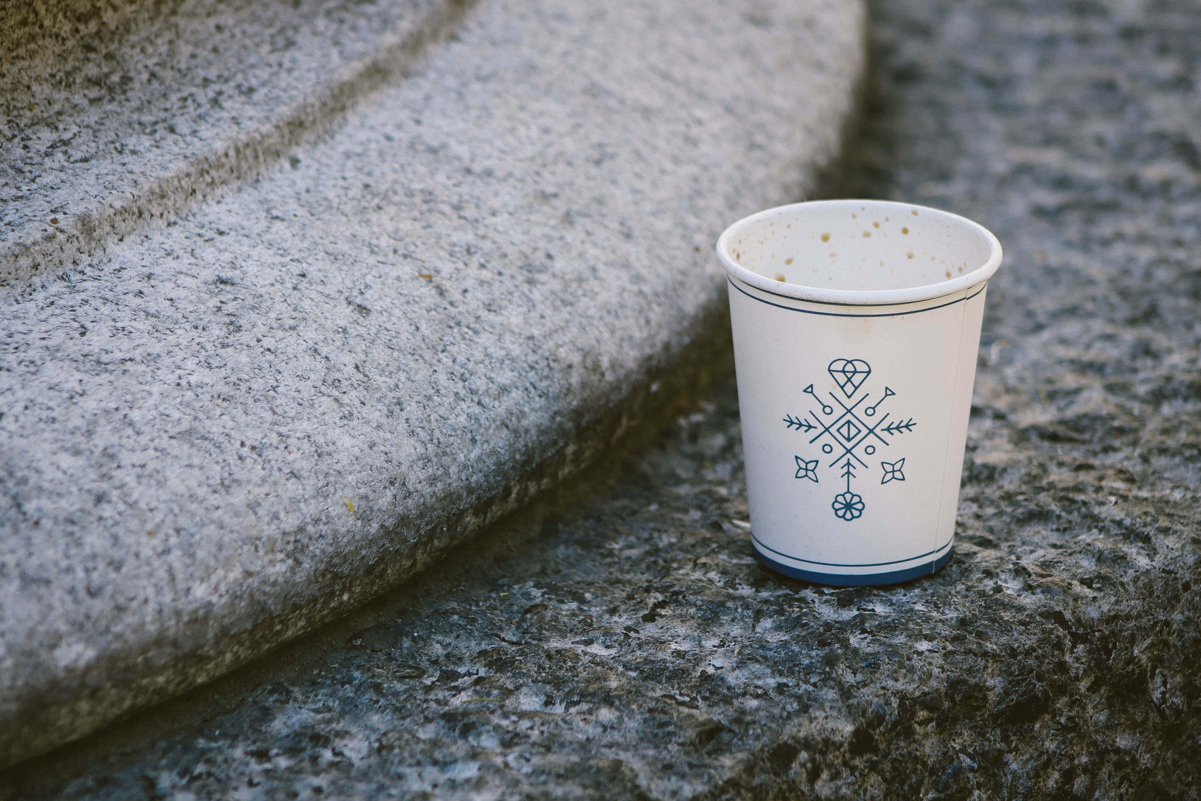 paper cup, blue geometric snowflake design, textured gray stone steps, 4K Desktop Wallpaper