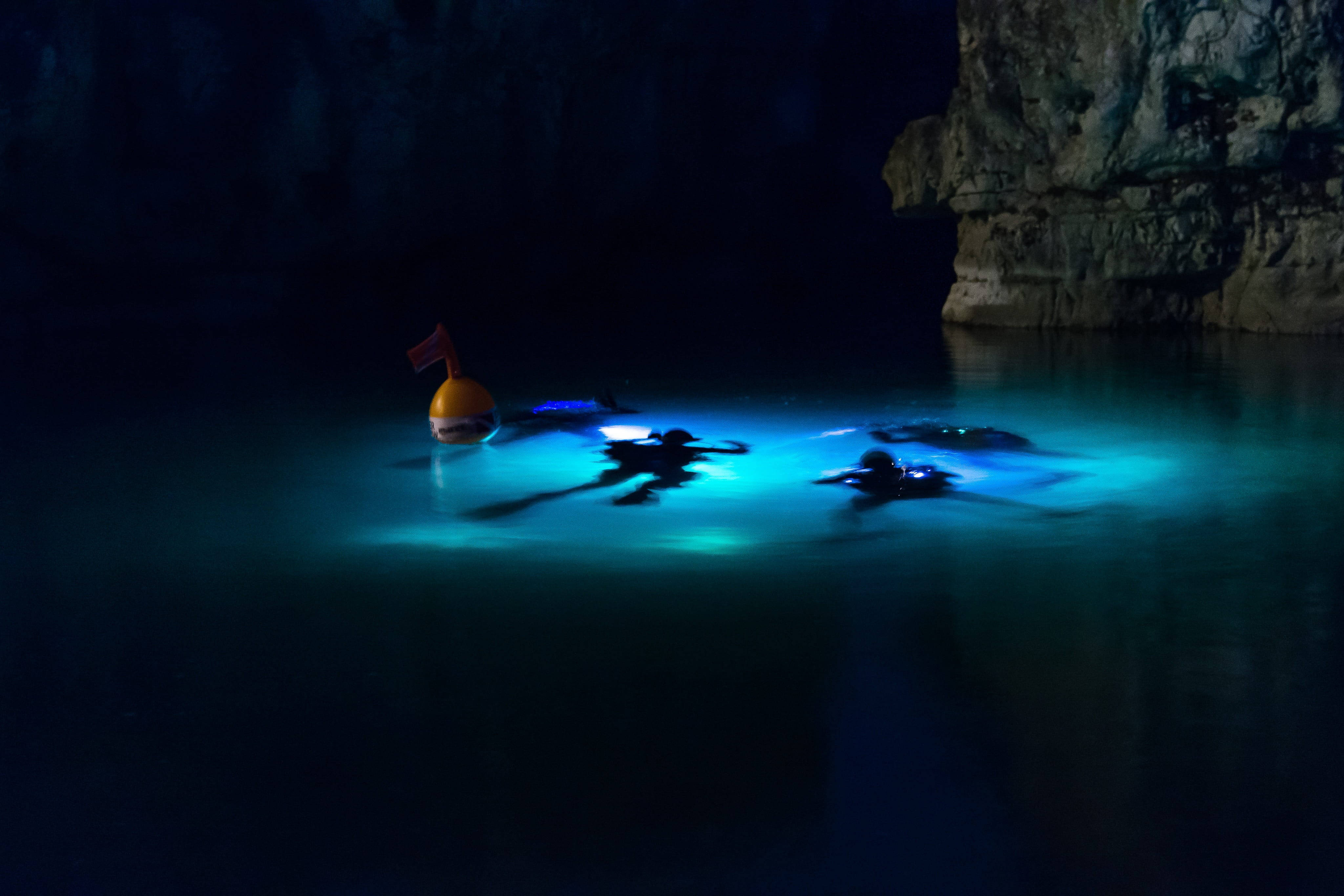 glowing lagoon, underwater cave, rugged rock walls, 4K Desktop Wallpaper
