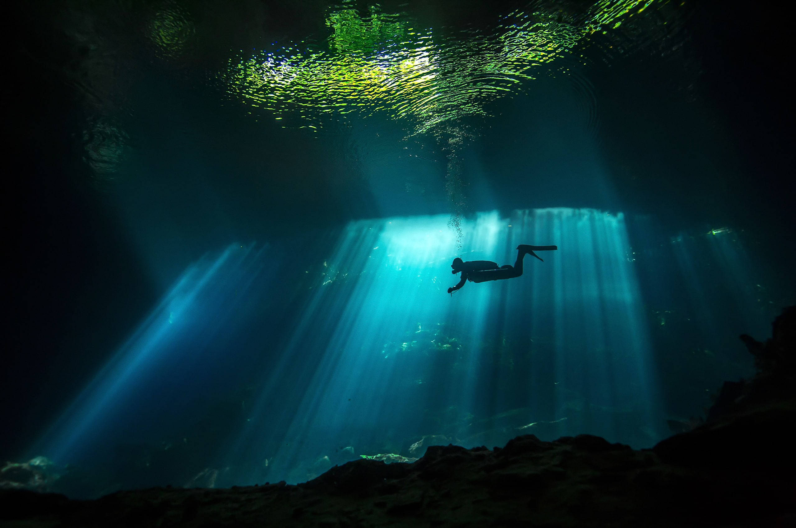 scuba diving, silhouette shot, dark underwater cave, 2K Desktop Wallpaper