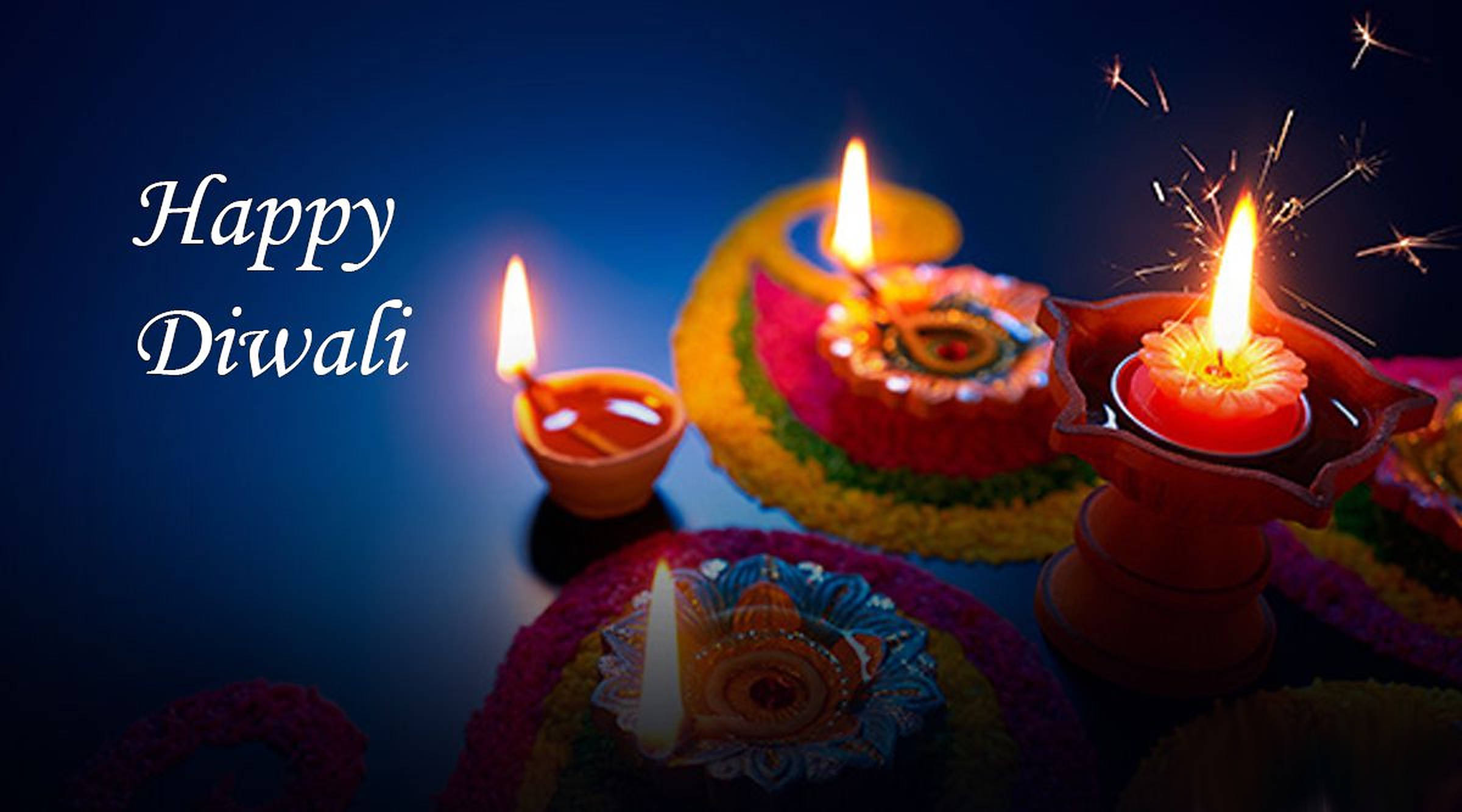 Glowing Diwali diyas, sparklers, colorful festive arrangement, Full HD Desktop Wallpaper