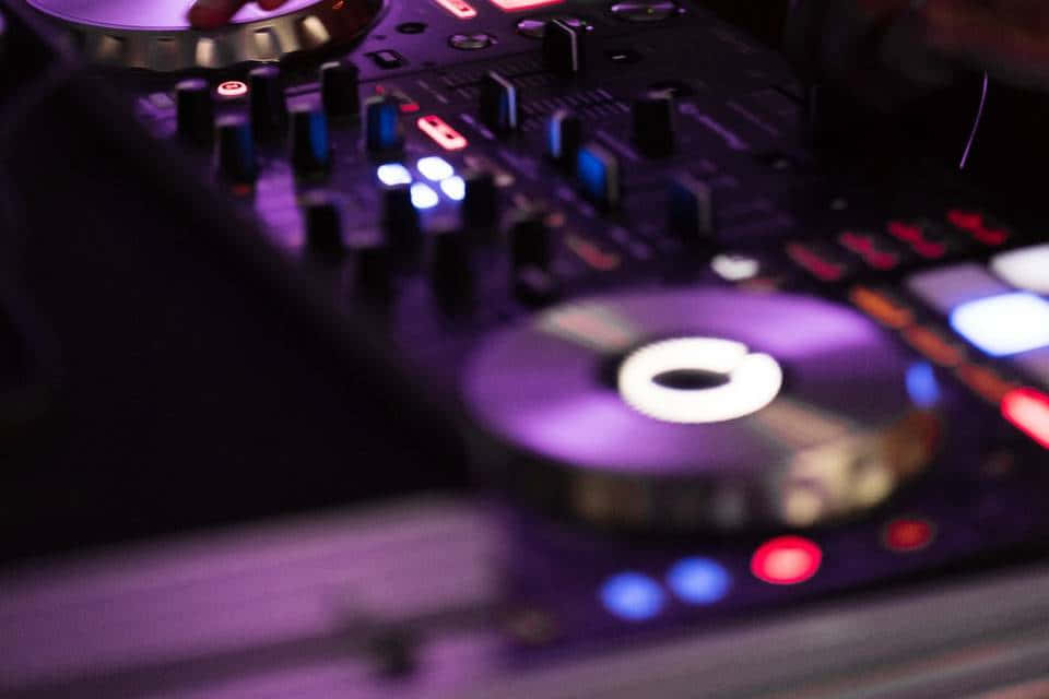 DJ controller, purple blue and red lights, dim club setting, SD Desktop Wallpaper