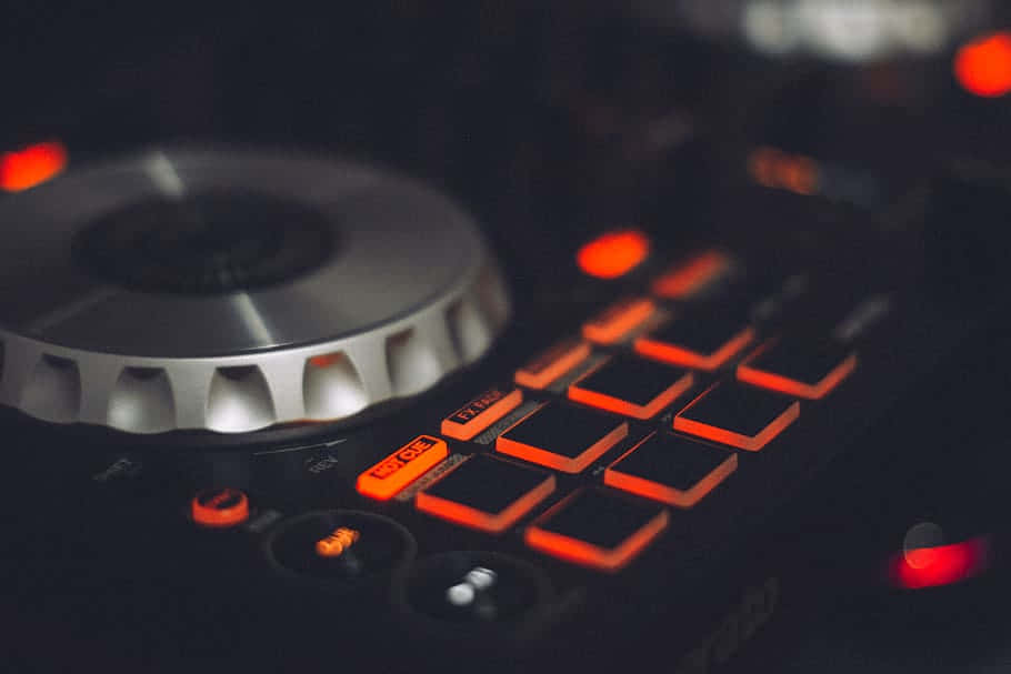 DJ controller, glowing orange buttons, metallic jog wheel, SD Desktop Wallpaper