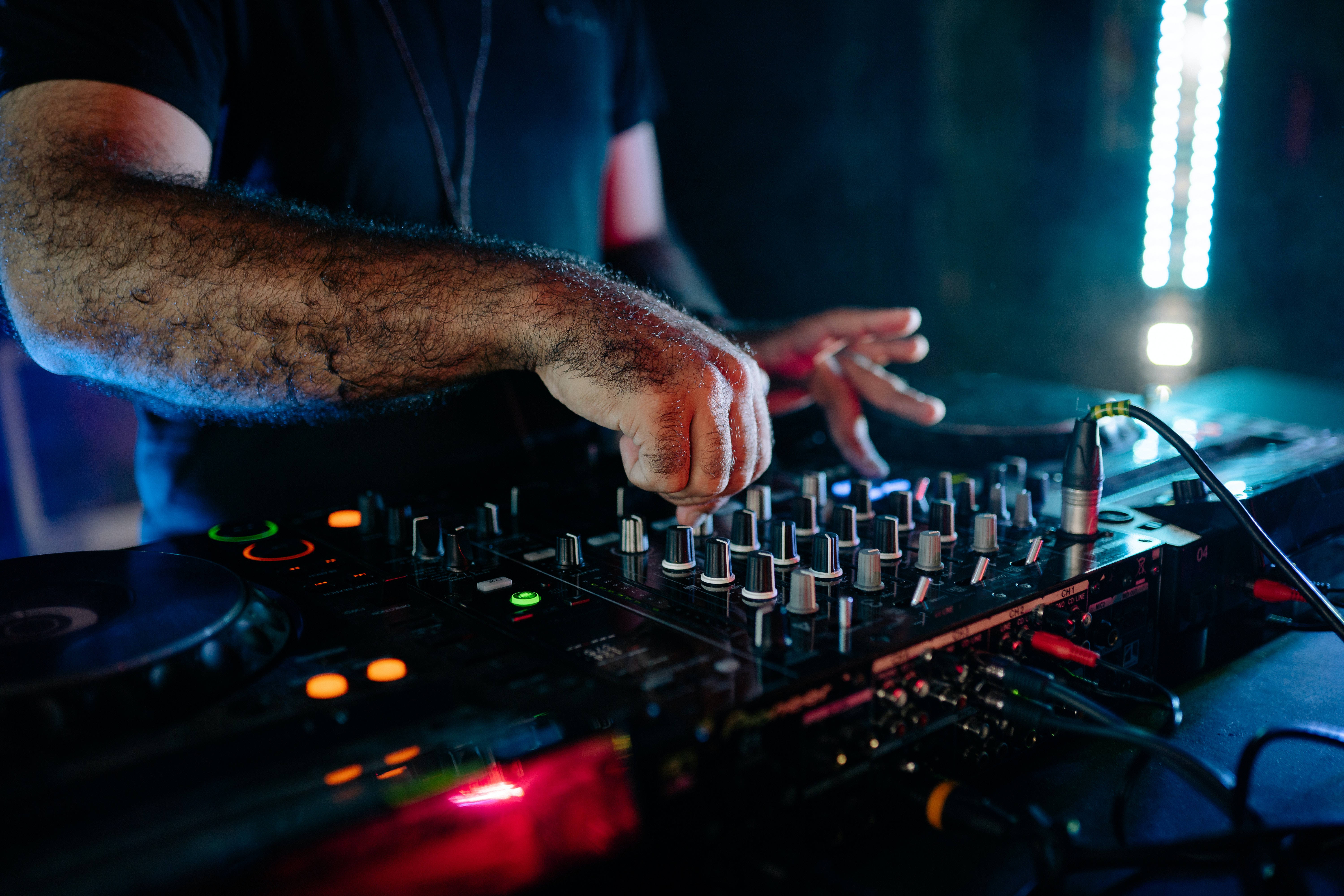 DJ, tattooed arm, glowing mixer, 5K Desktop Wallpaper