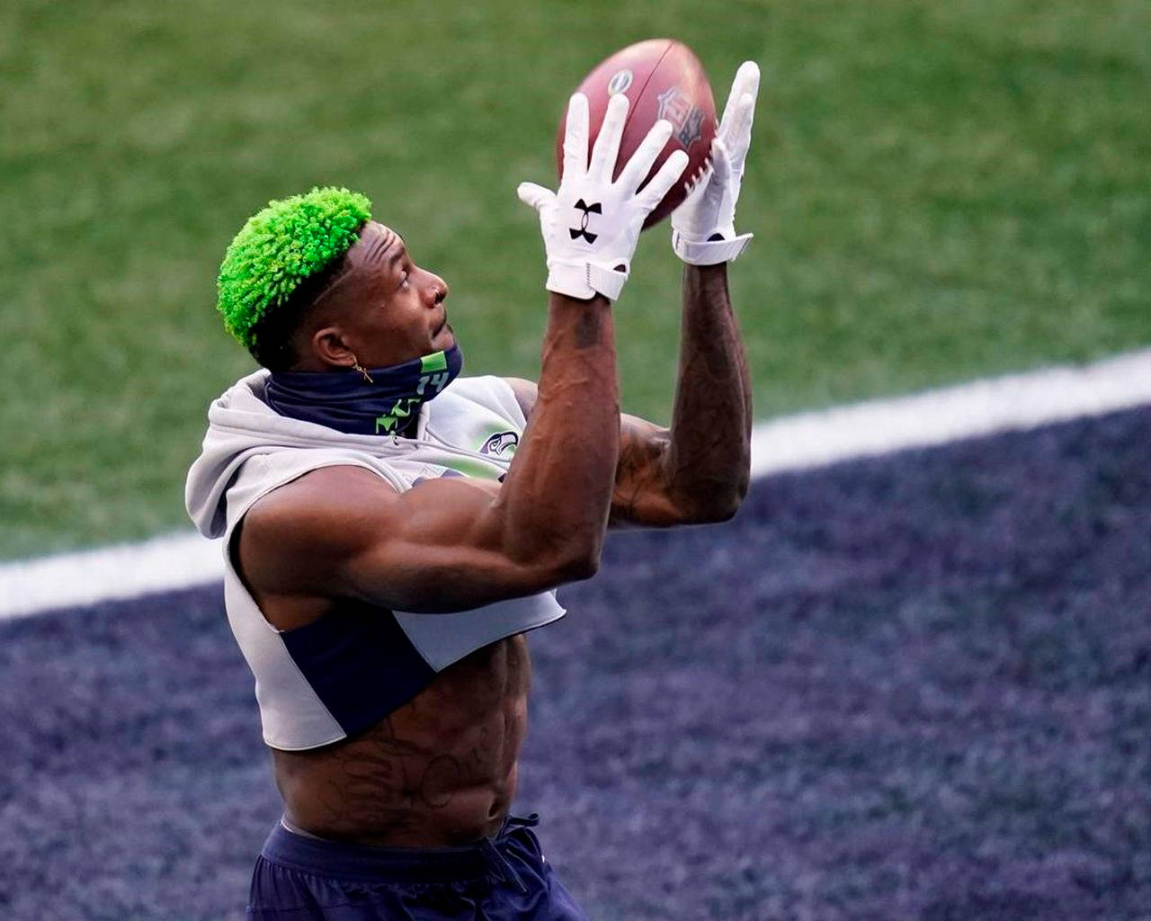 DK Metcalf, bright green hair, catches a ball mid-air, HD Desktop Wallpaper