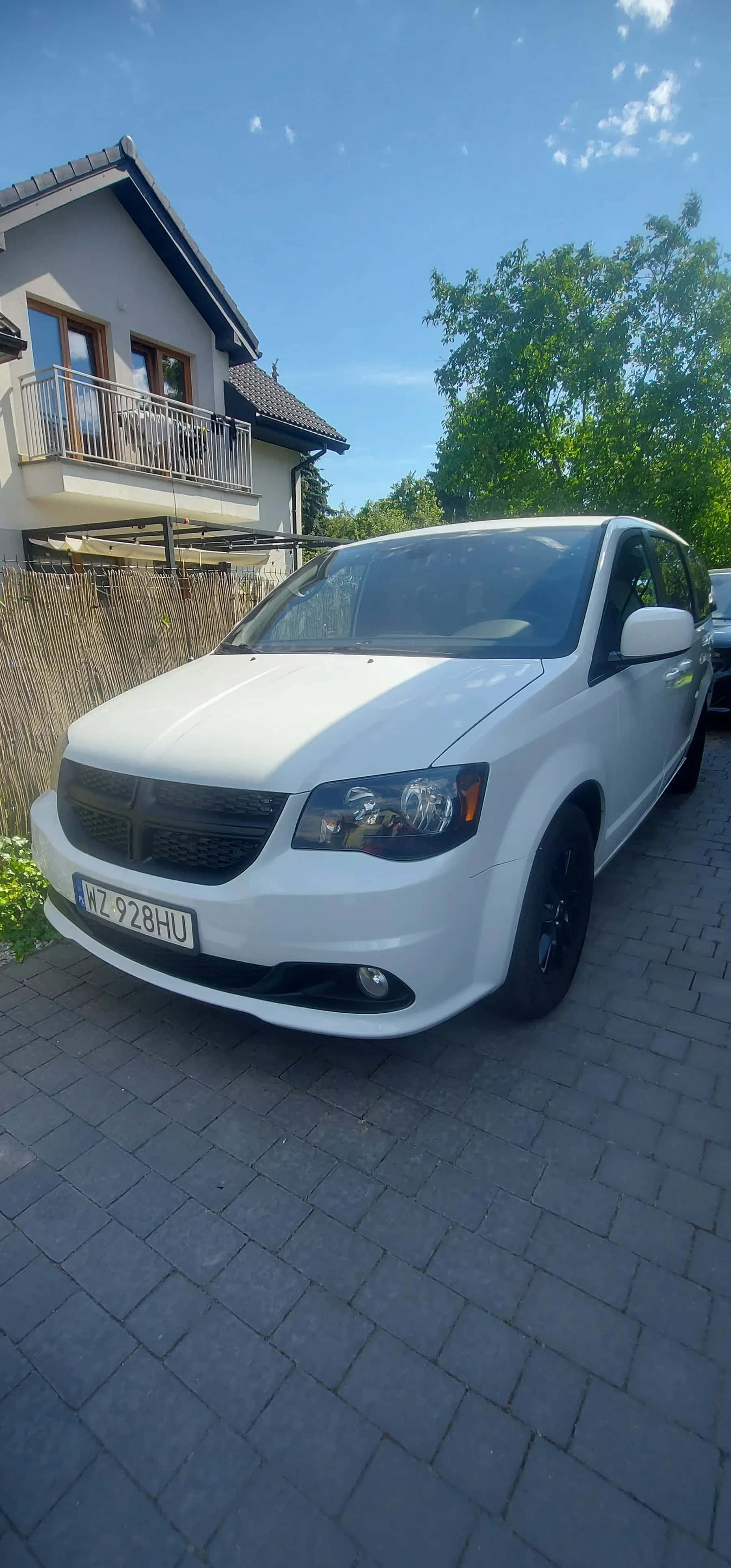 White Dodge Grand Caravan, gray brick driveway, modern house, 4K Phone Wallpaper